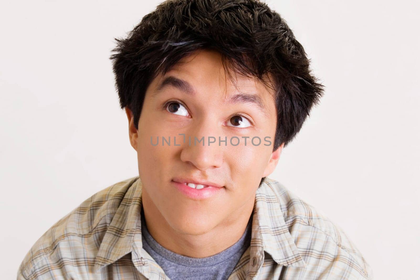 Close-up of a young man looking up