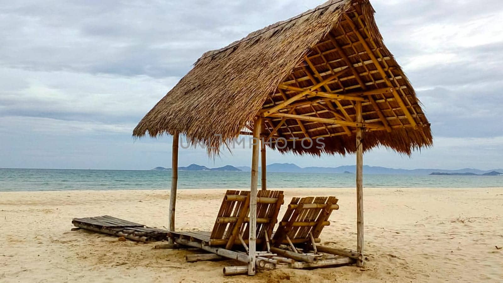 A canopy of bamboo and reeds on the beach.