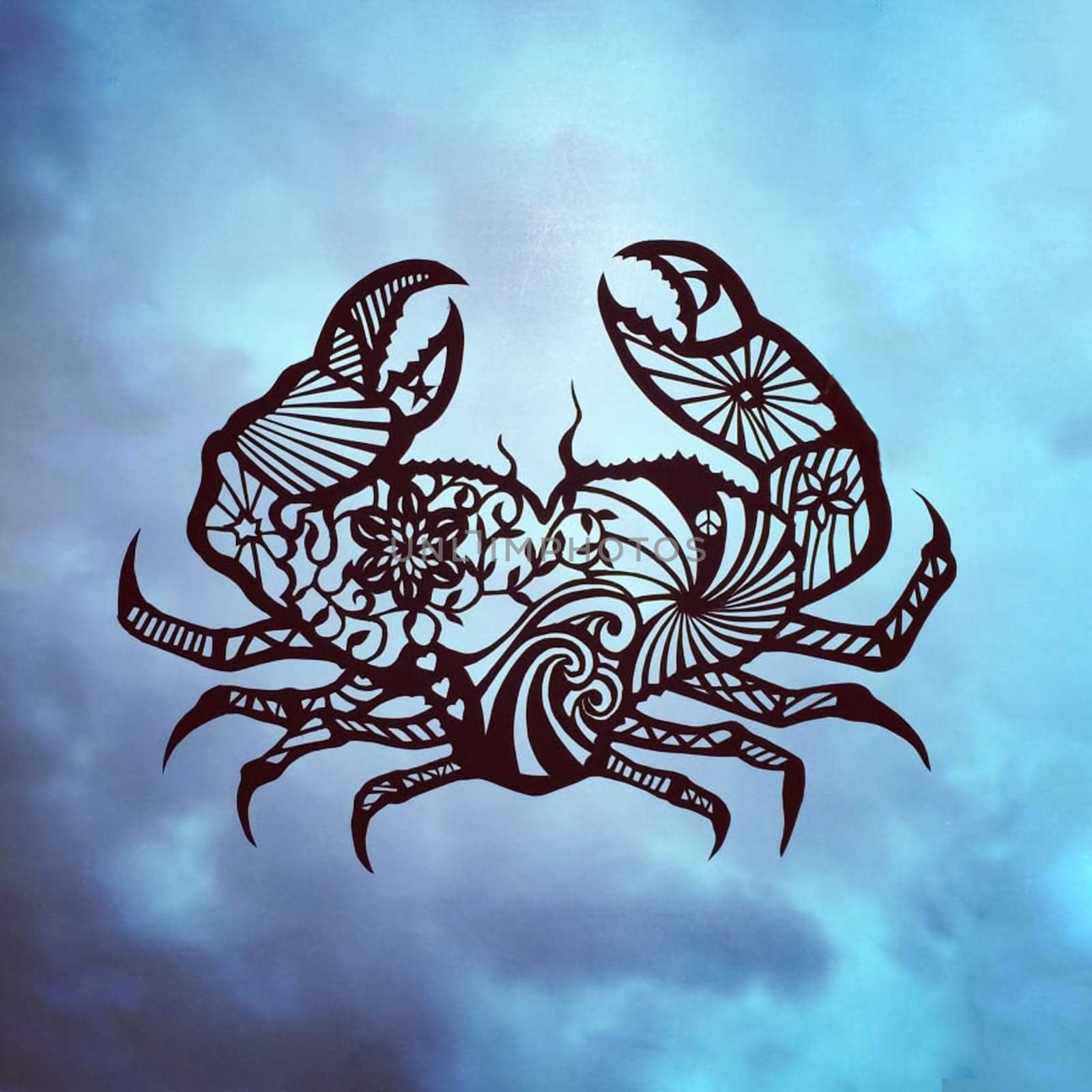 Crab figurine made of paper against the blue sky. Figurine of an animal.