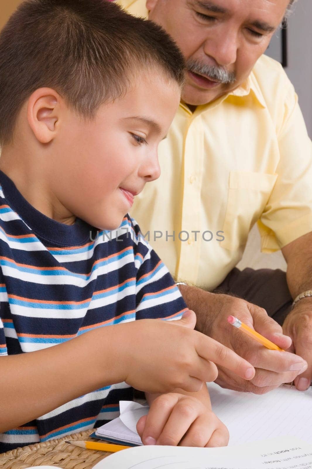 Close-up of a senior man teaching his grandson