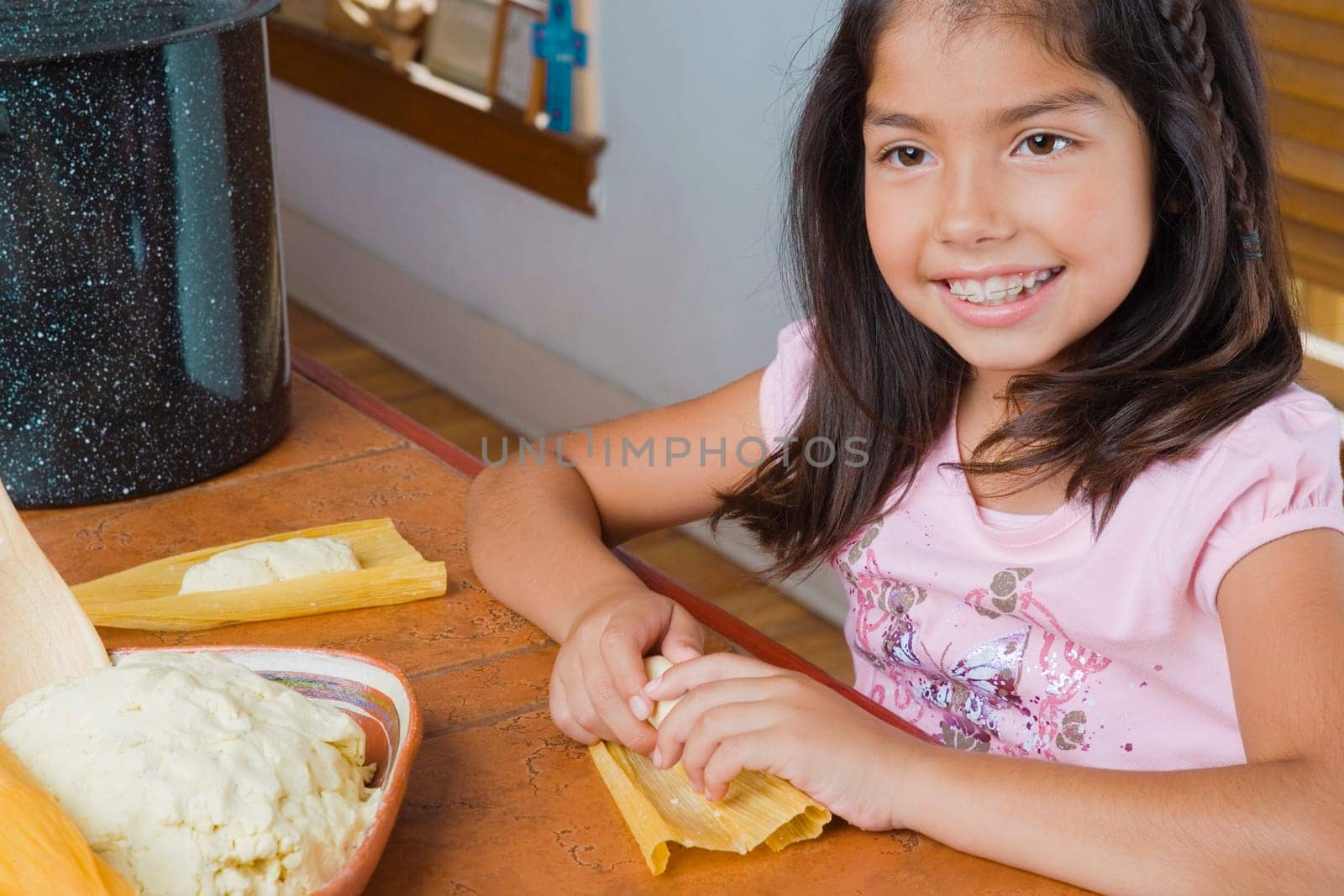 Close-up of a girl preparing bread