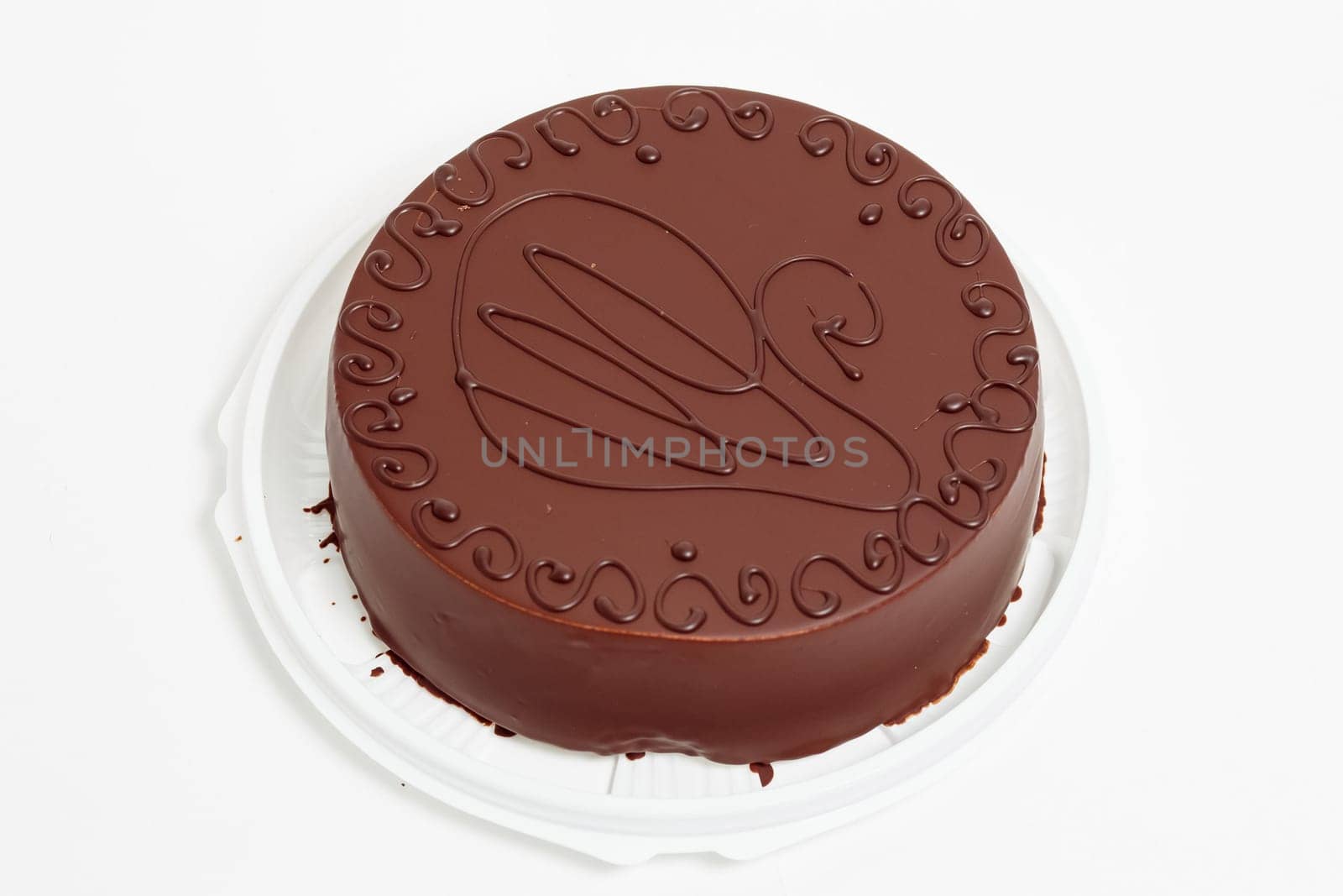 Cake in chocolate glaze on a white background. Chocolate cake.