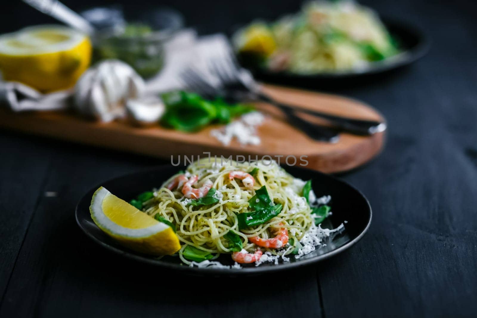 Noodles with seafood and lemon. A dish in a restaurant.
