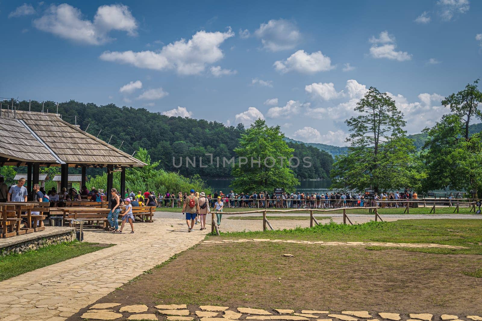 Plitvicka Jezera, Croatia, July 2019 Tourists in wooden restaurant and queuing for ferry in Plitvice Lakes National Park UNESCO World Heritage