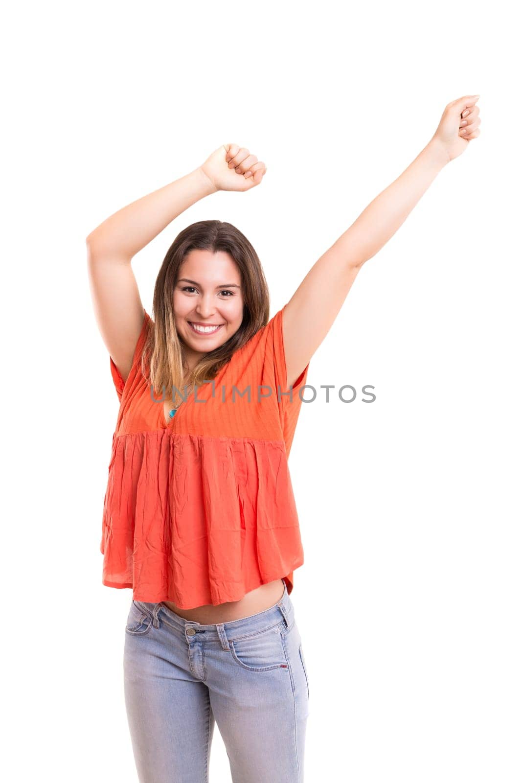 Studio shot: Happy woman with raised arms