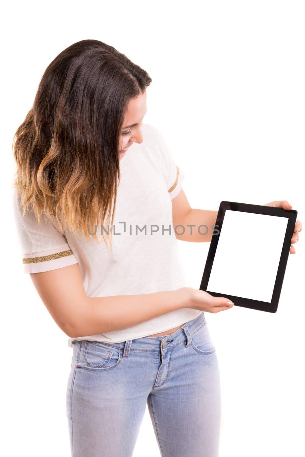 Happy young woman presenting your product in a tablet computer