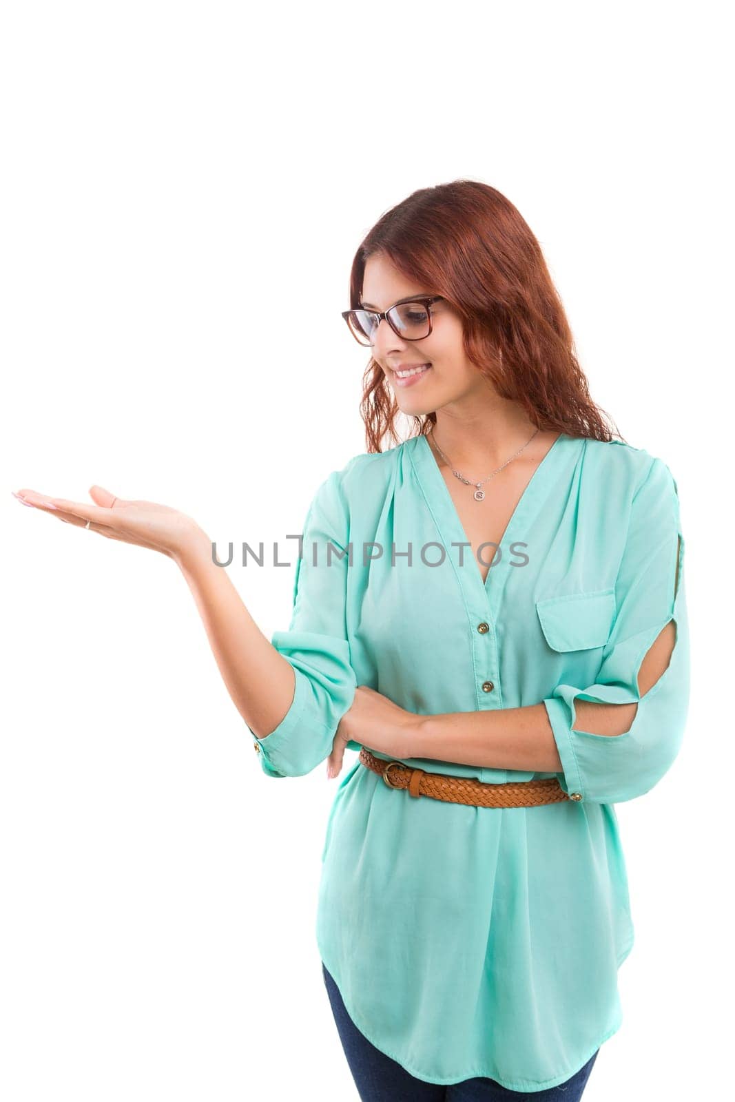 Young beautiful woman presenting your product, isolated over white background
