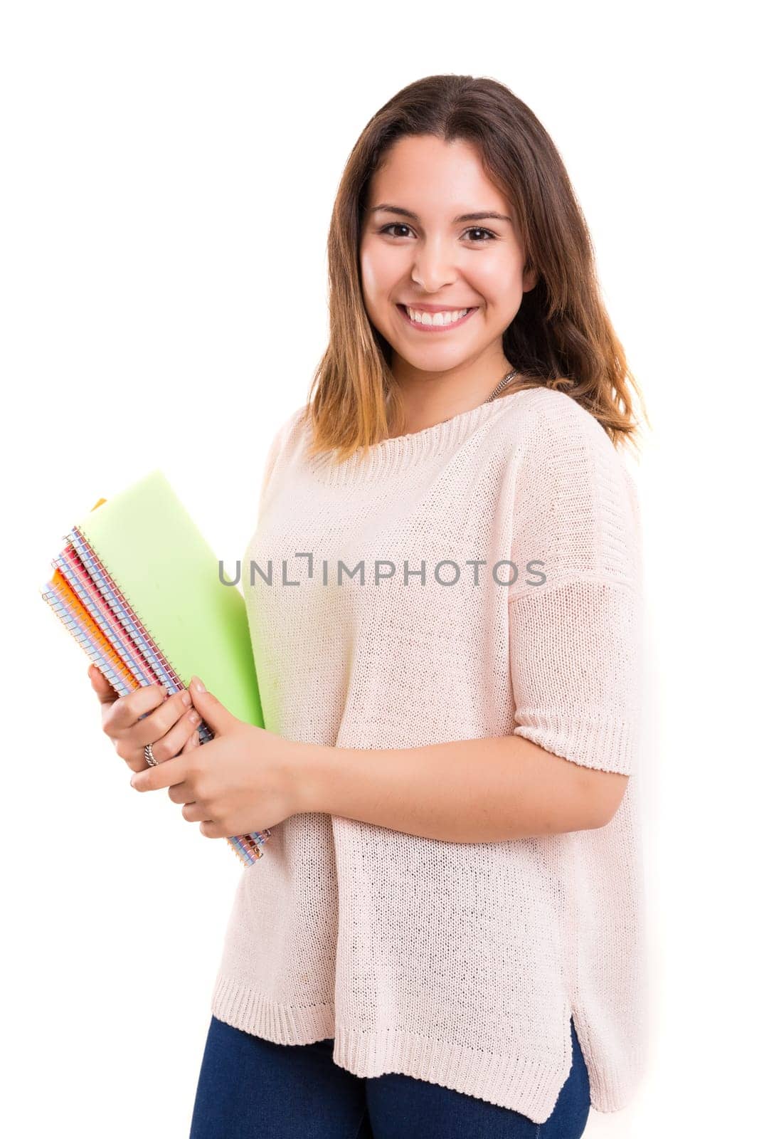 Young student posing over a white background