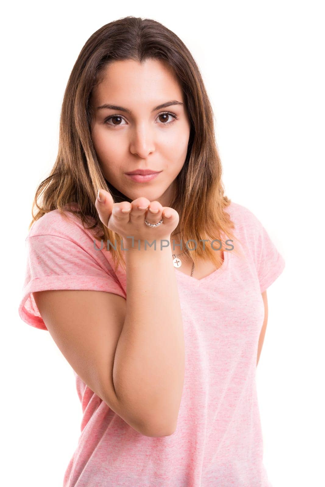 Beautiful young woman blowing you a kiss, isolated over white