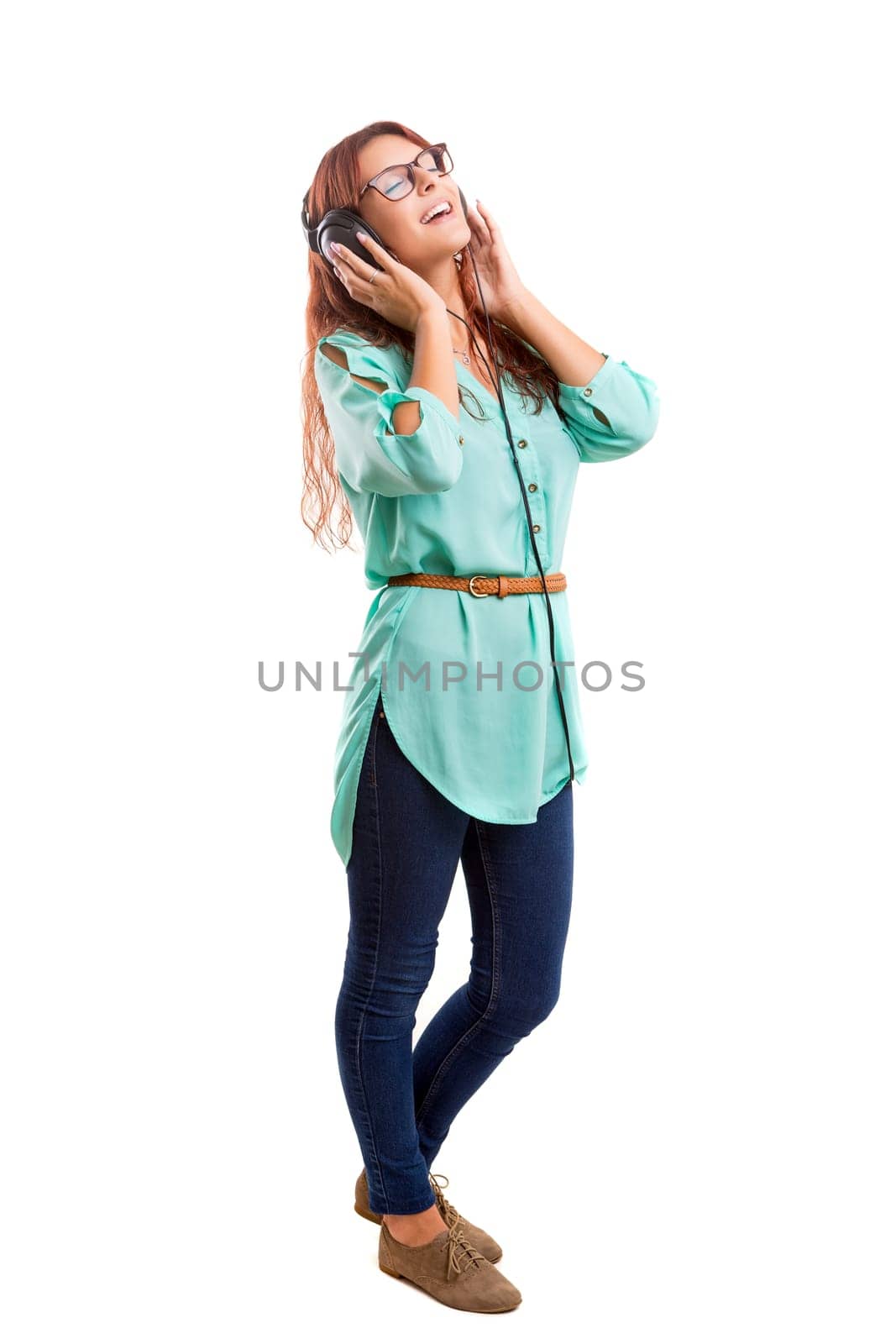 A Happy young woman listening to music