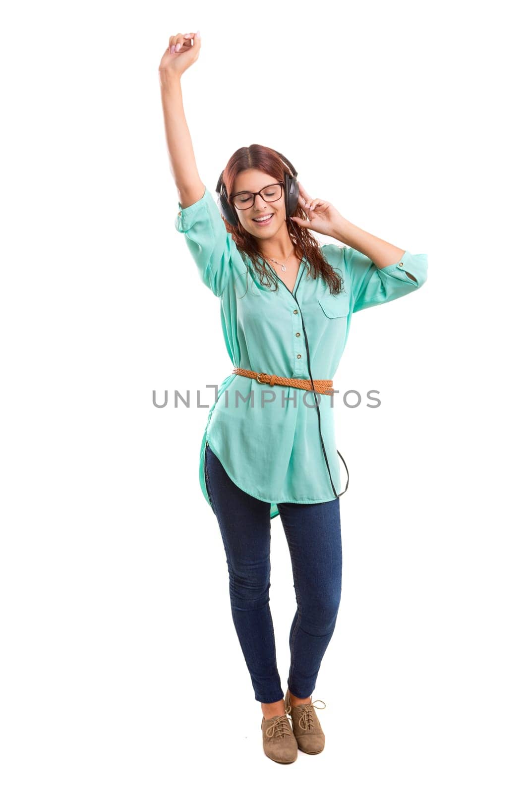 A Happy young woman listening to music