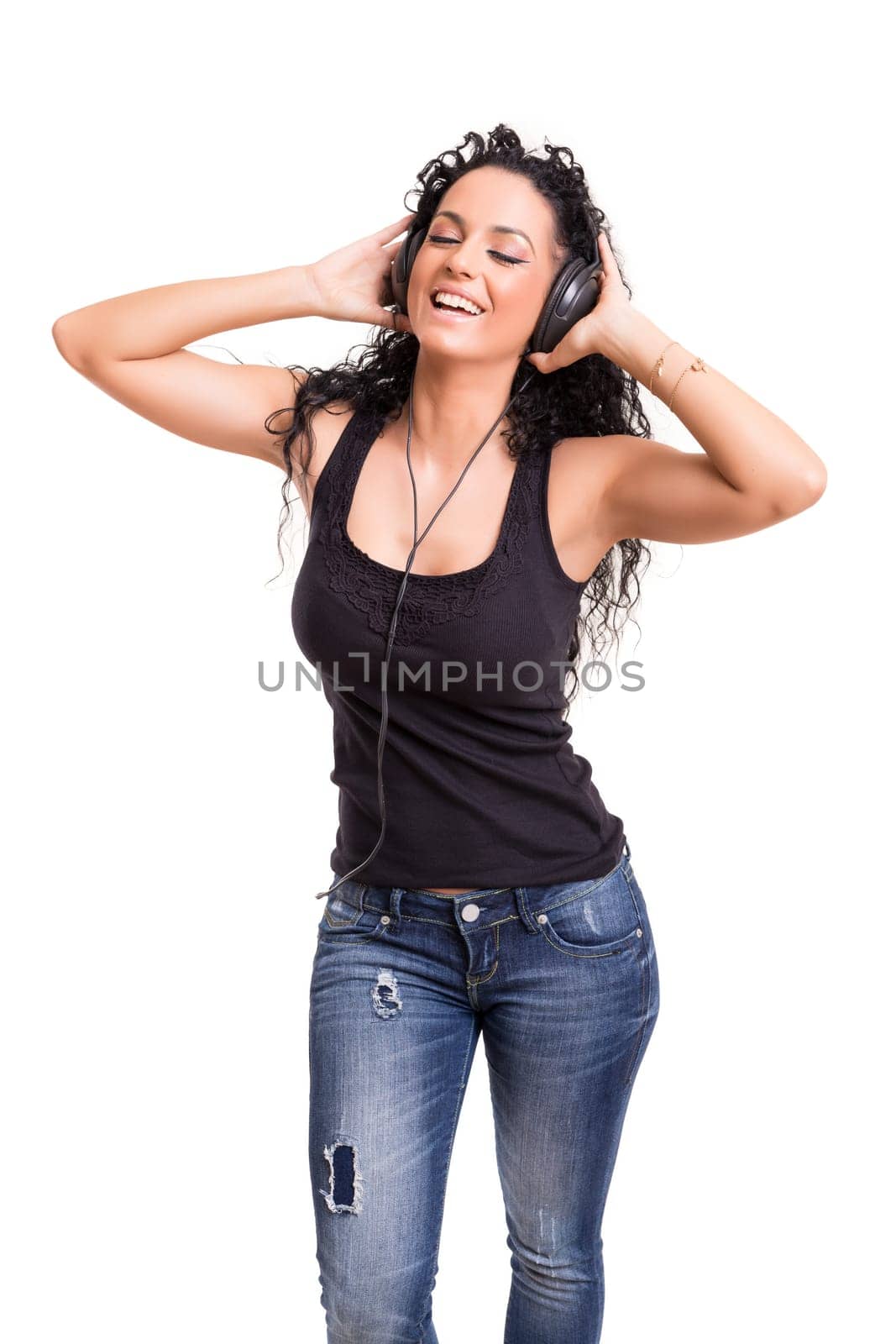 A Happy young woman listening to music