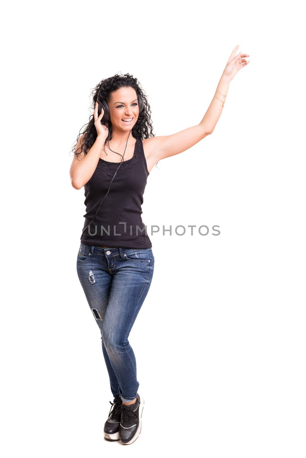 A Happy young woman listening to music