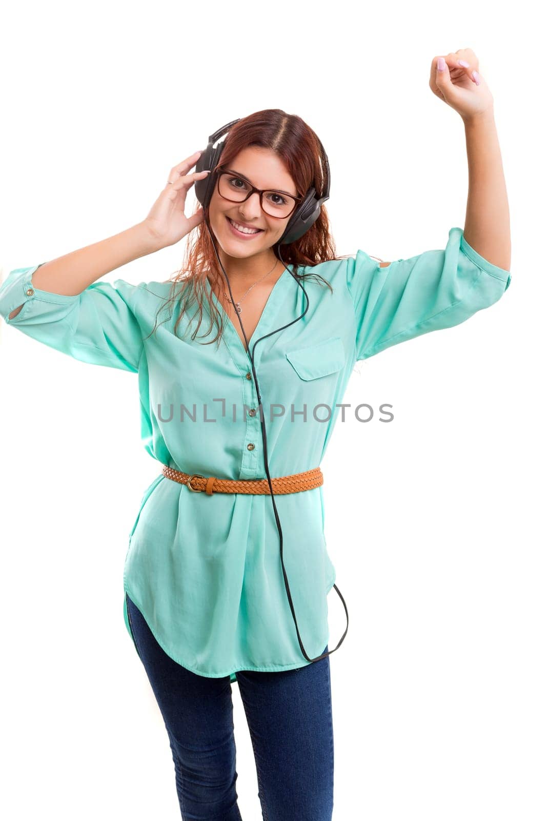 A Happy young woman listening to music