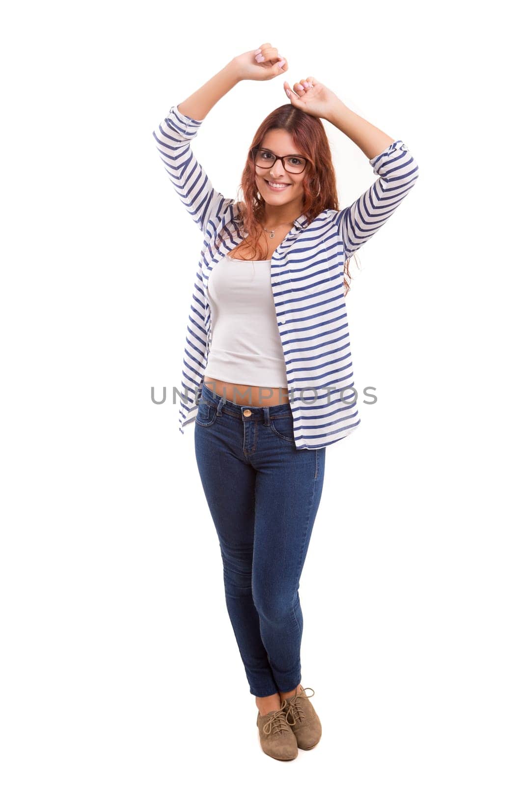 Studio shot: Happy woman with raised arms