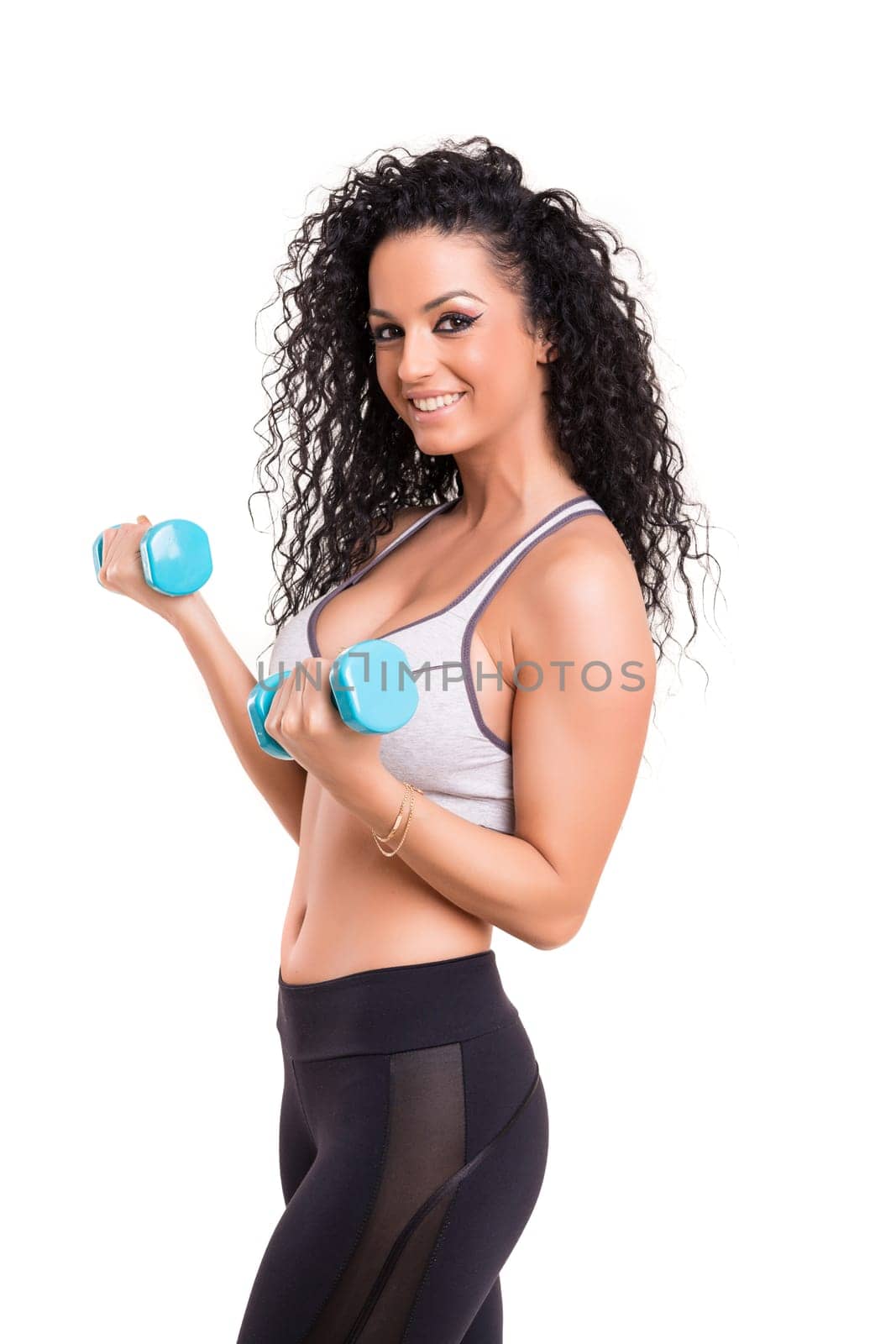 A beautiful young woman exercising - fitness concept