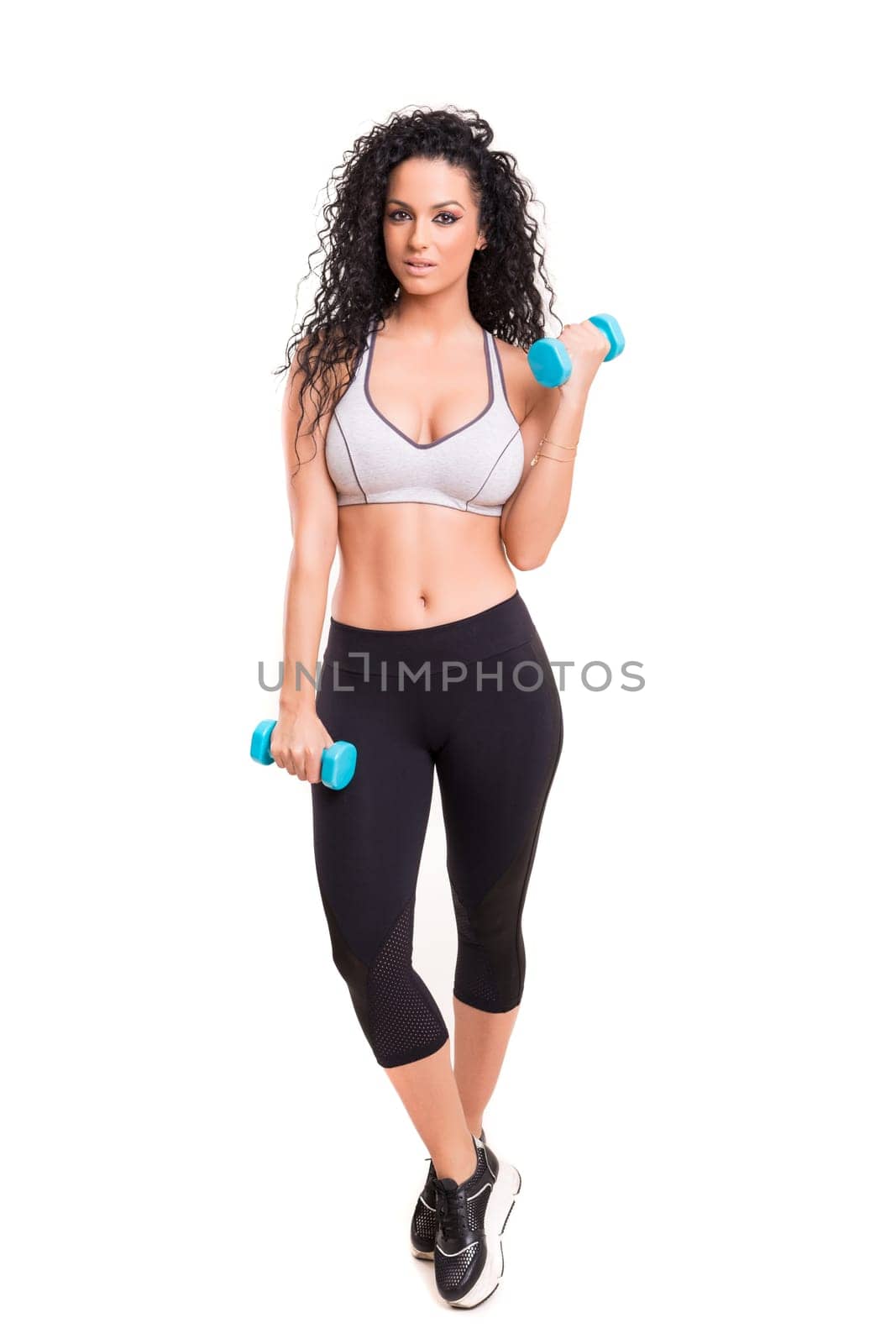 A beautiful young woman exercising - fitness concept