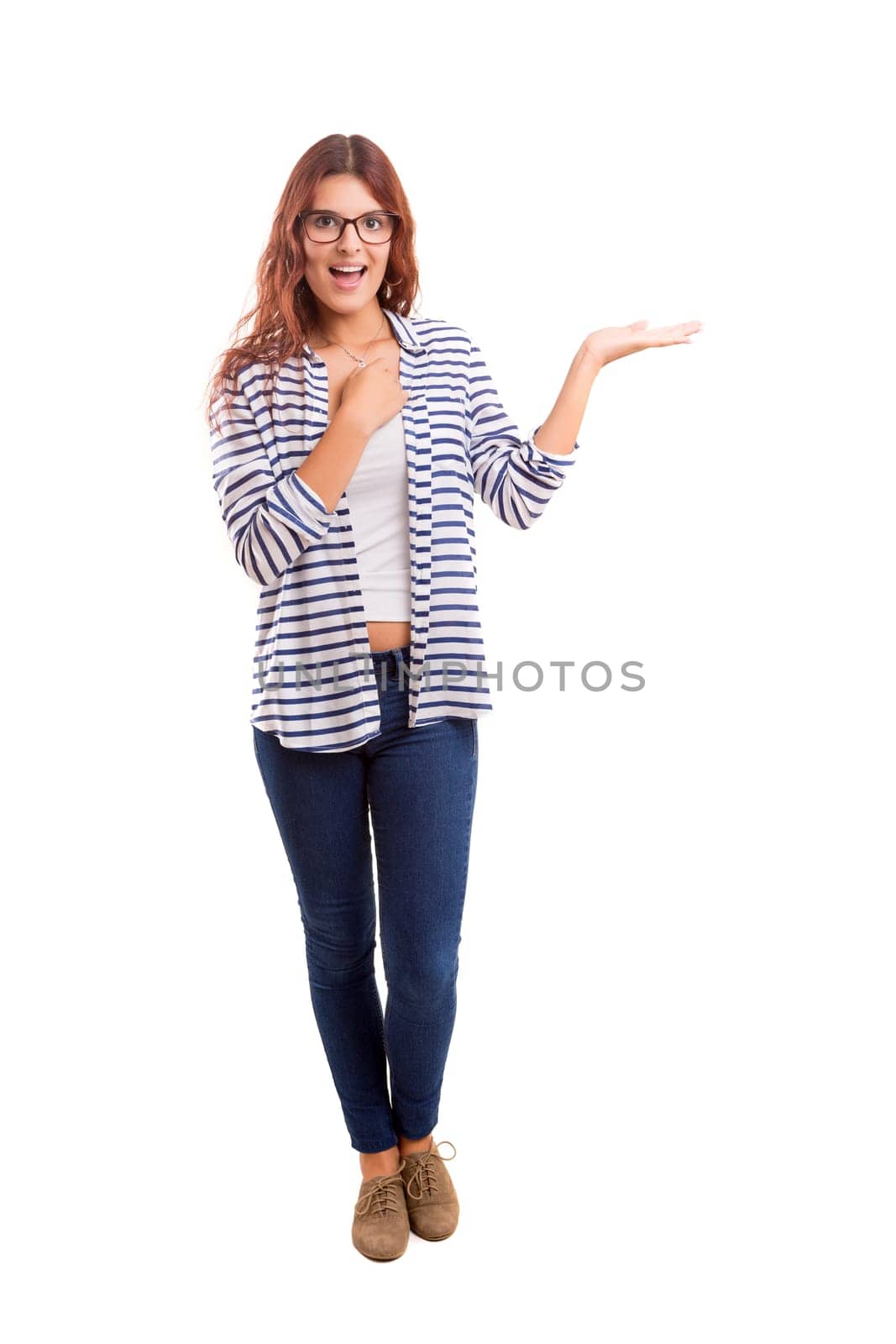 Young beautiful woman presenting your product, isolated over white background