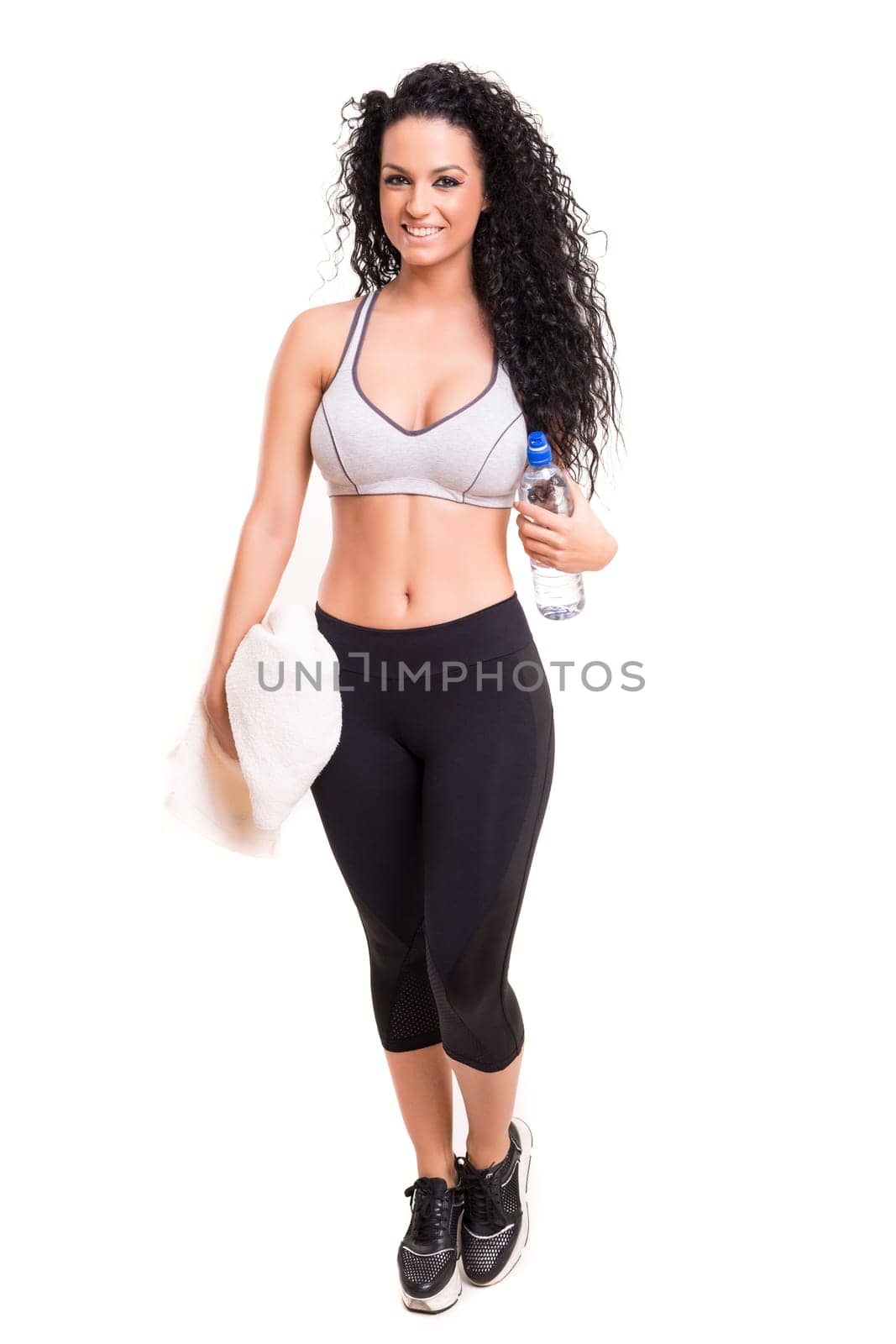 A beautiful young woman exercising - fitness concept