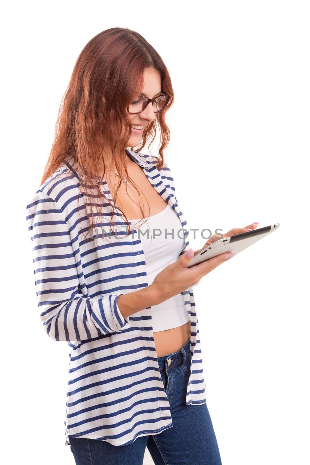 Beautiful woman relaxing with a tablet computer