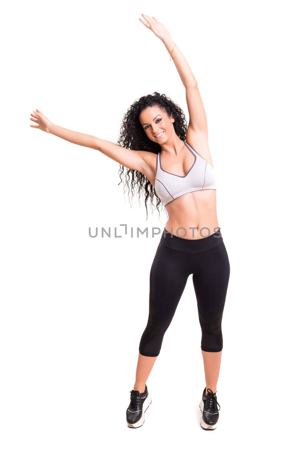 A beautiful young woman exercising - fitness concept