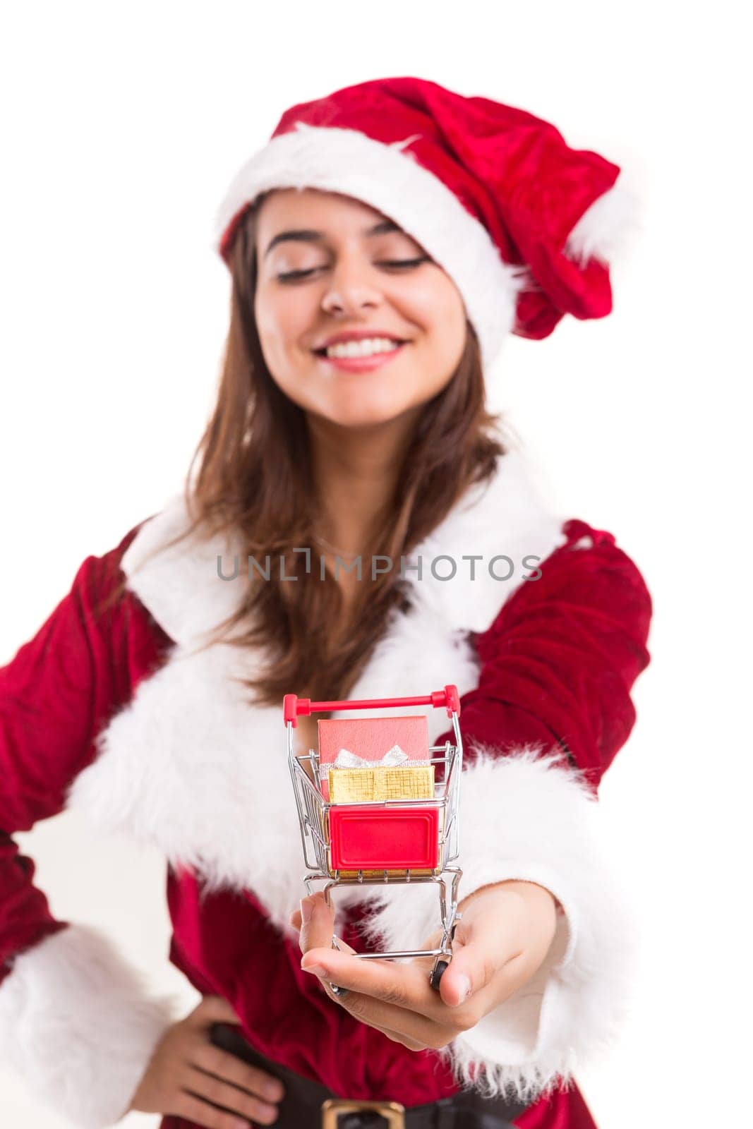 Young woman dress in Christmas costume, presenting your product