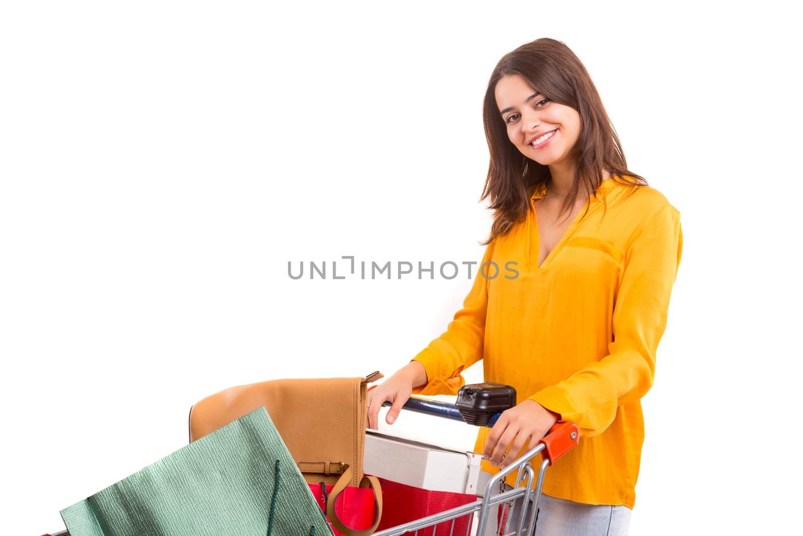 Woman carrying a shopping cart full of gifts