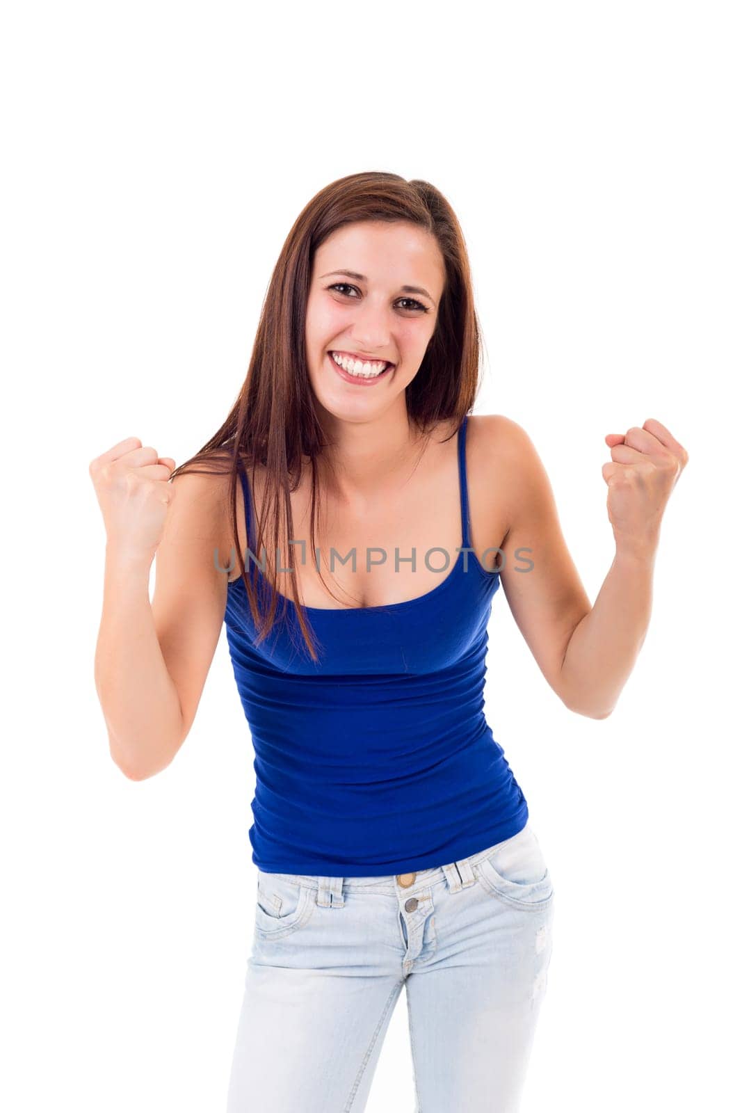 Studio shot: Happy woman with raised arms