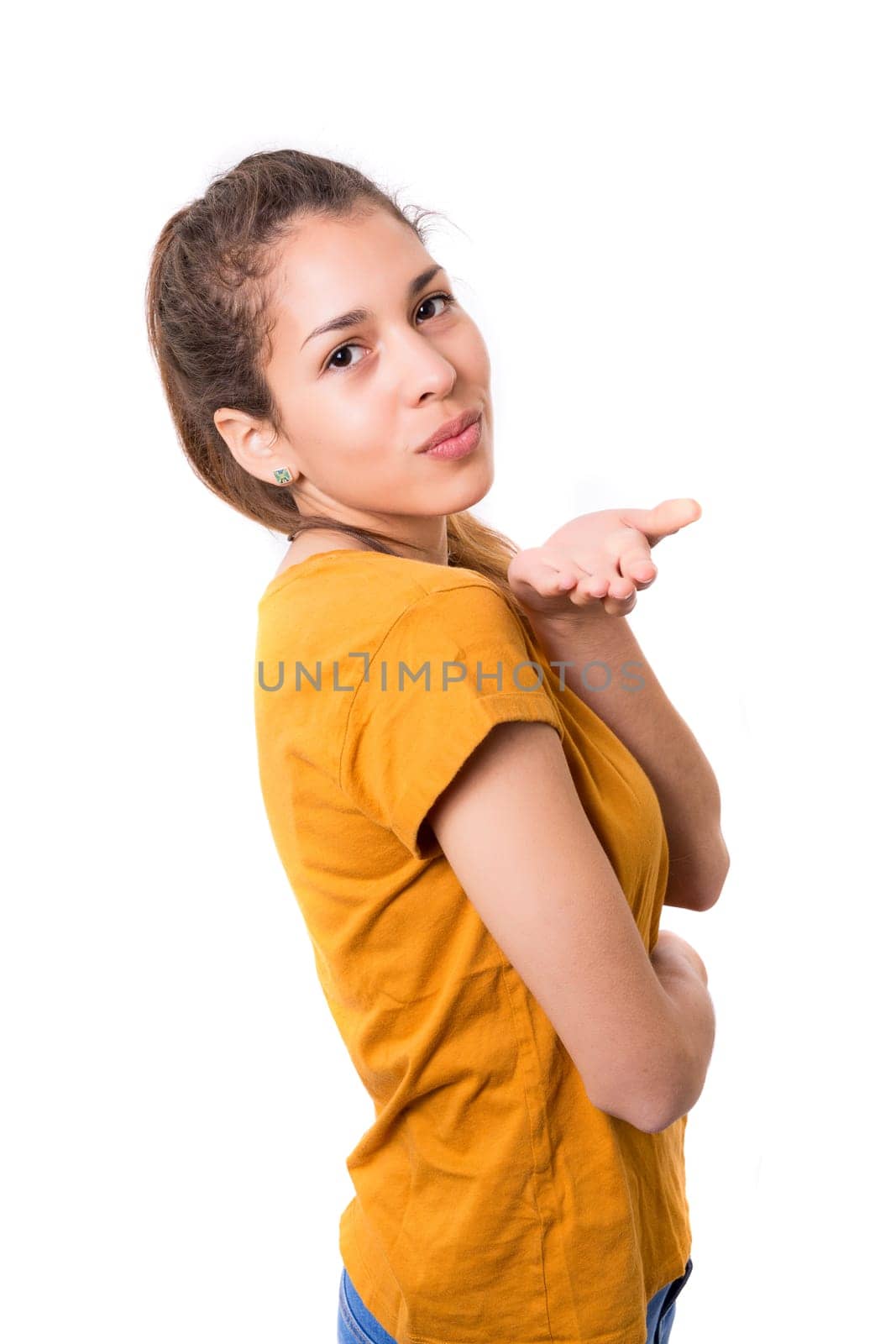 Beautiful young woman blowing you a kiss, isolated over white