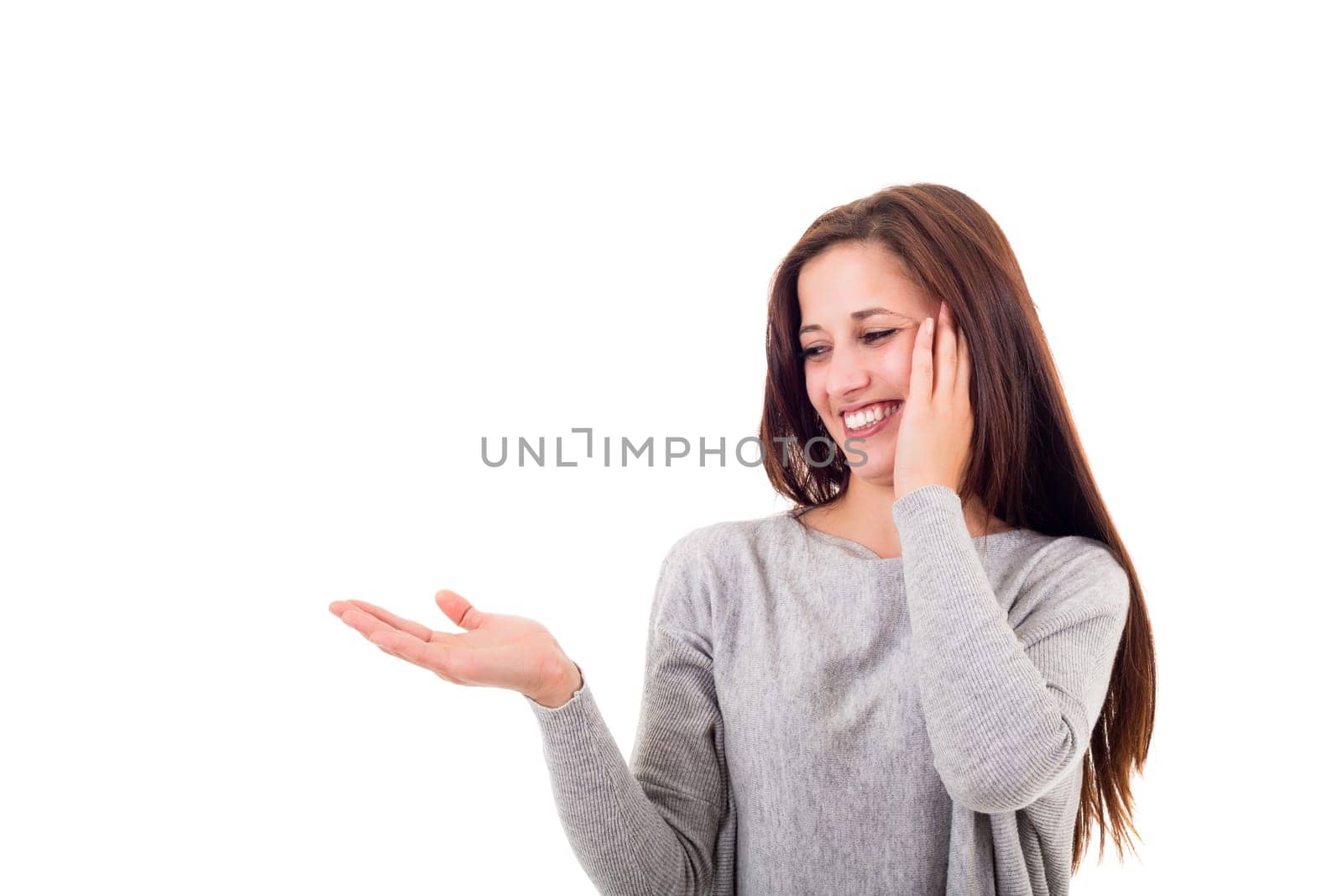 Young beautiful woman presenting your product, isolated over white background
