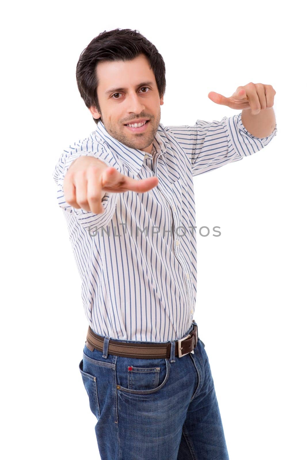 Handsome young man pointing at you, isolated over white background