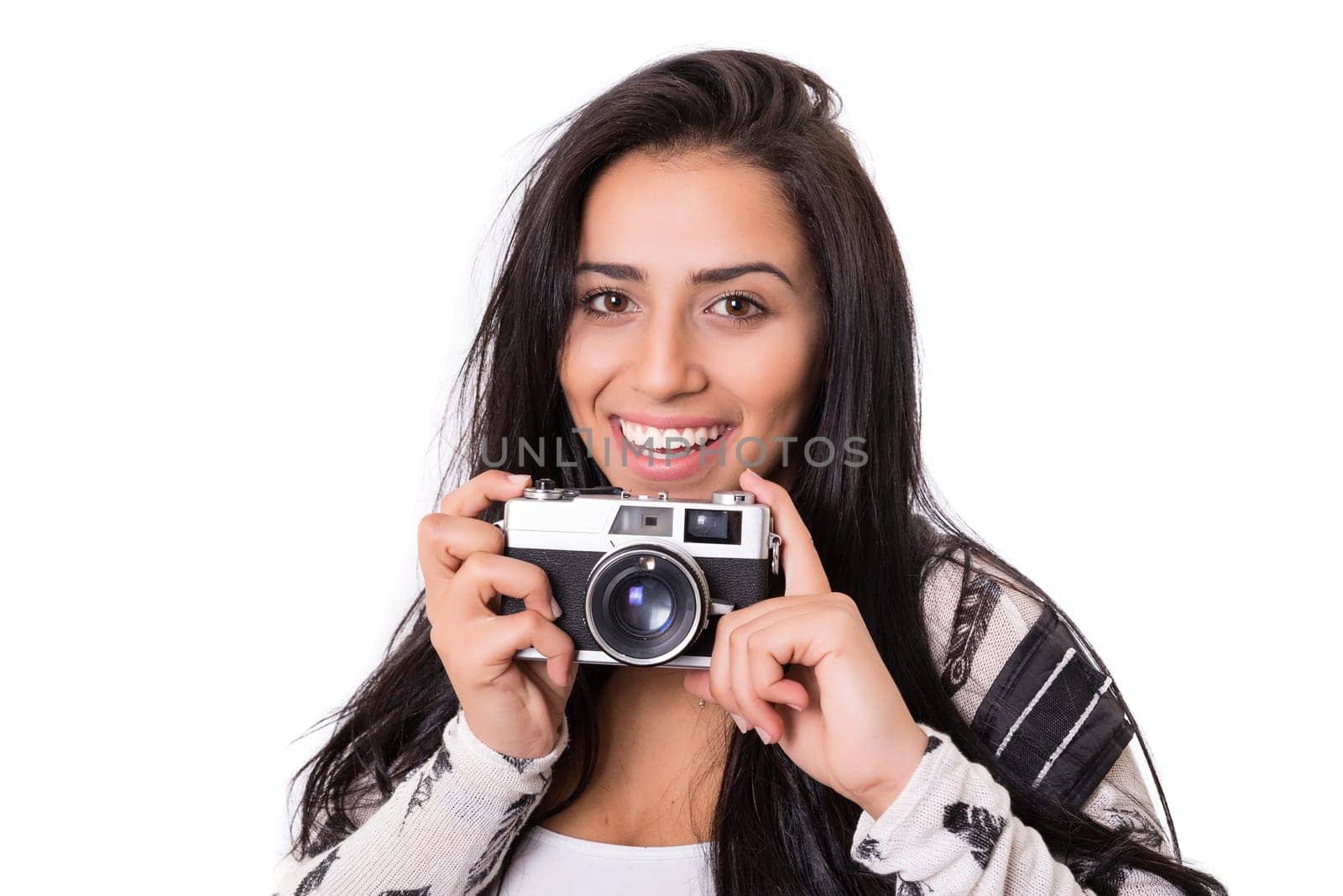 Beautiful woman holding a vintage camera, isolated over white background