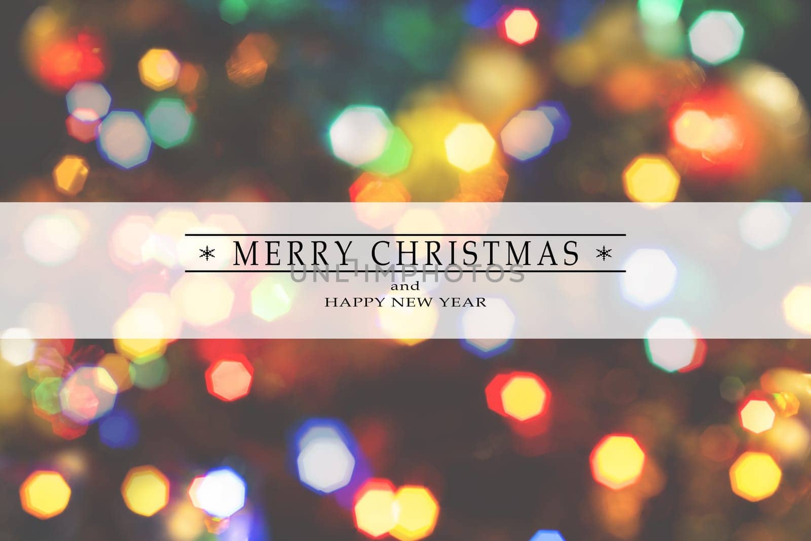Merry Christmas and Happy New Year greeting card, blurred background of the twinkling lights of the Christmas tree. Greeting card background.