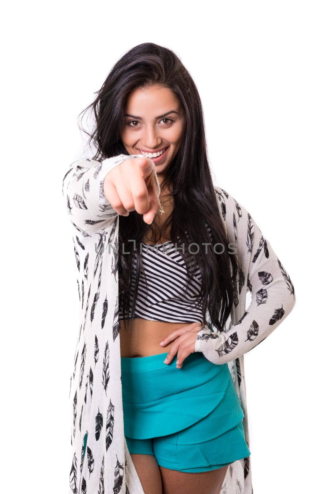 Young beautiful woman pointing at you, isolated over white