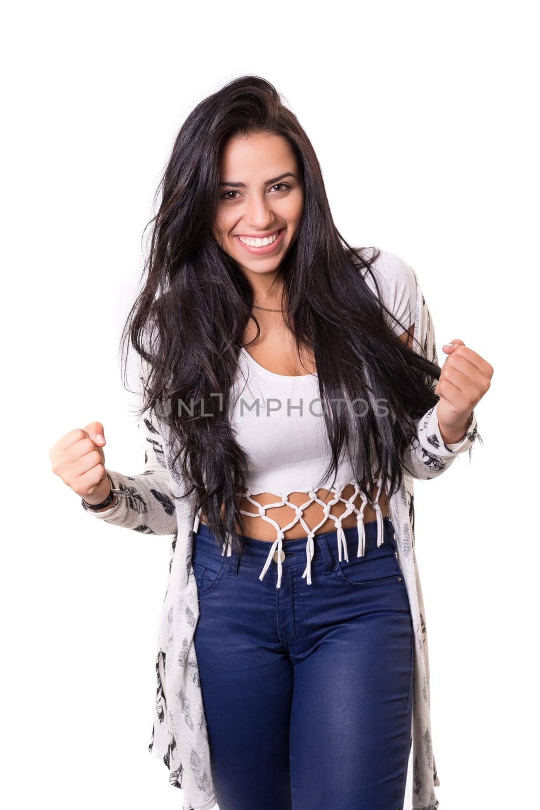 Studio shot: Happy woman with raised arms