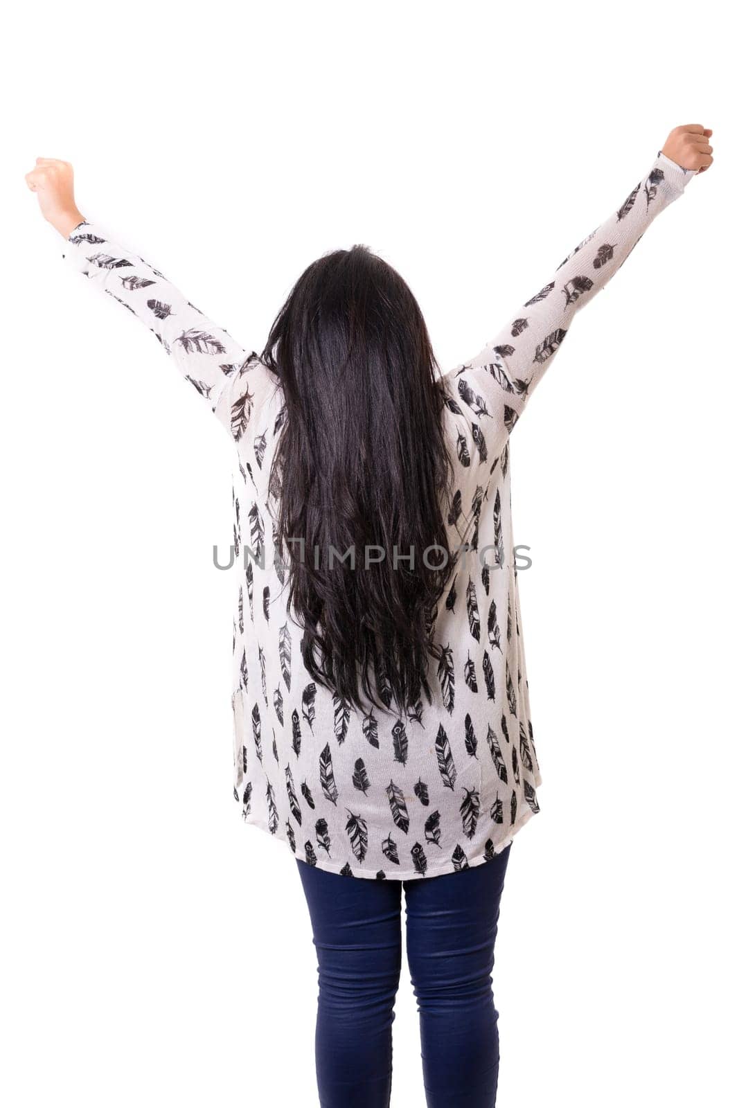Studio shot: Happy woman with raised arms