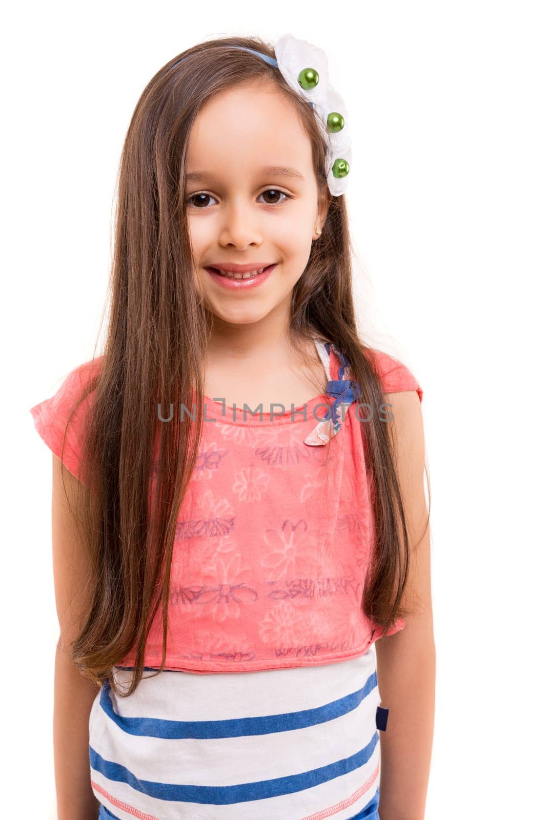 Beautiful young girl posing isolated over white