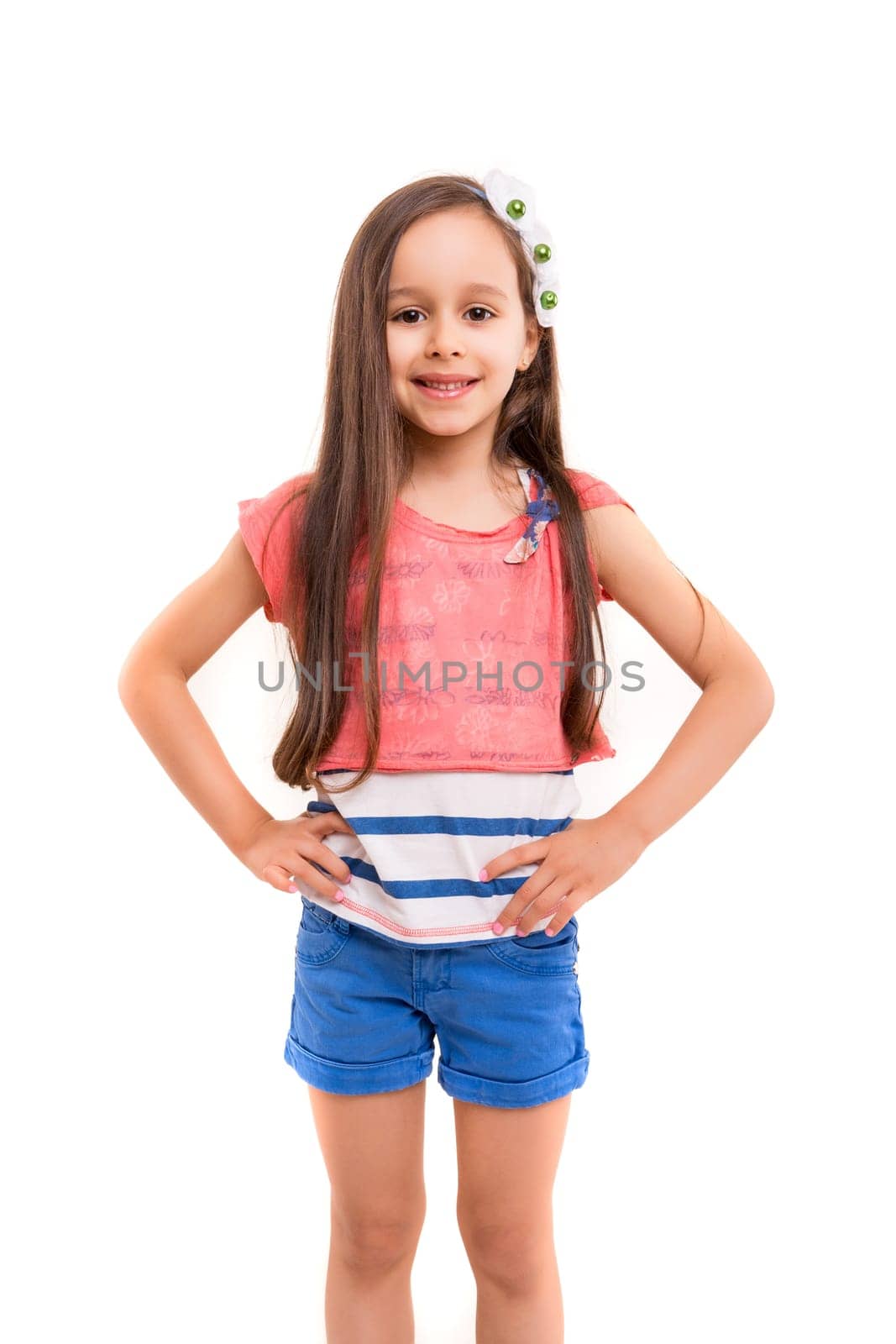Beautiful young girl posing isolated over white