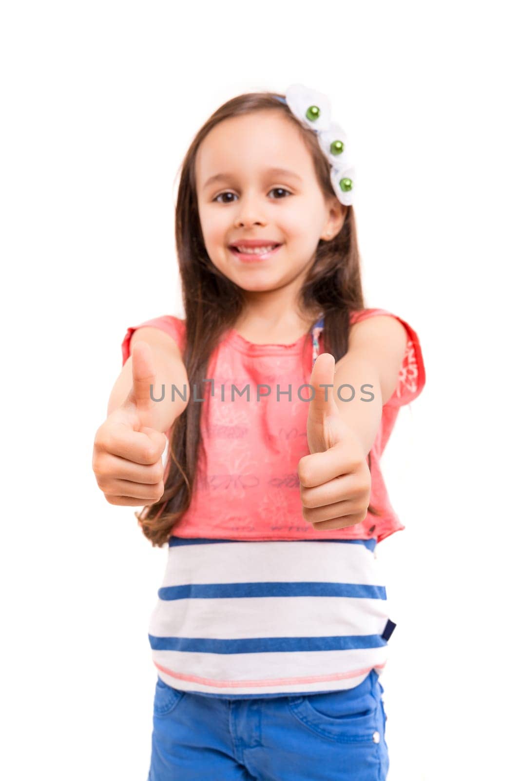 Small girl showing thumbs up, isolated over white background