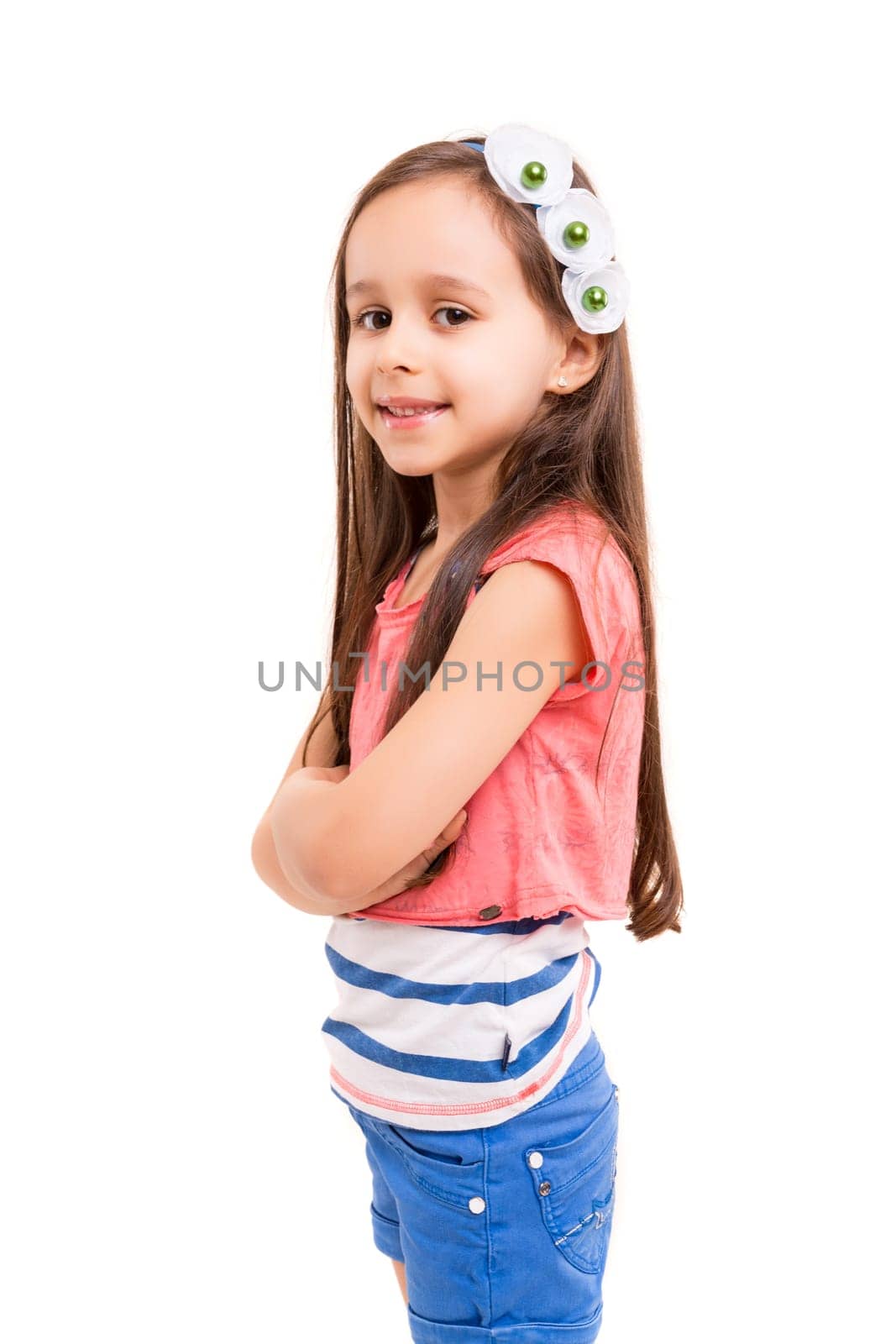 Beautiful young girl posing isolated over white