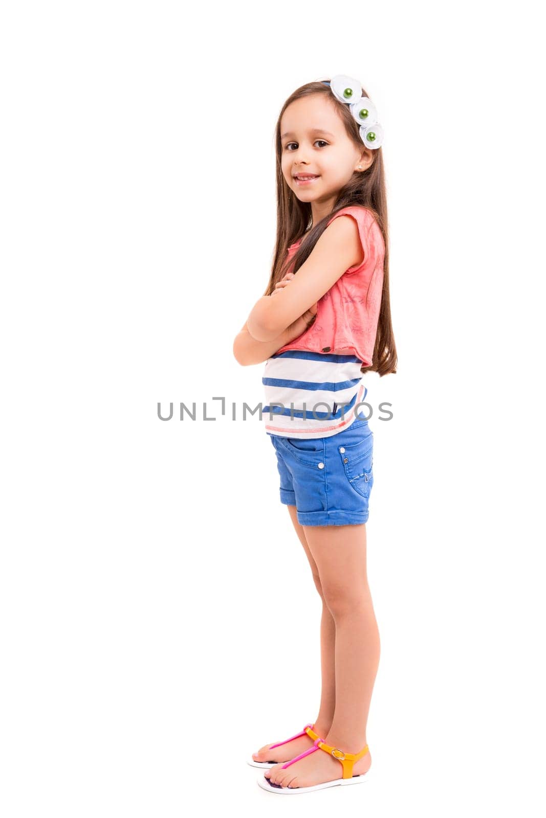 Beautiful young girl posing isolated over white