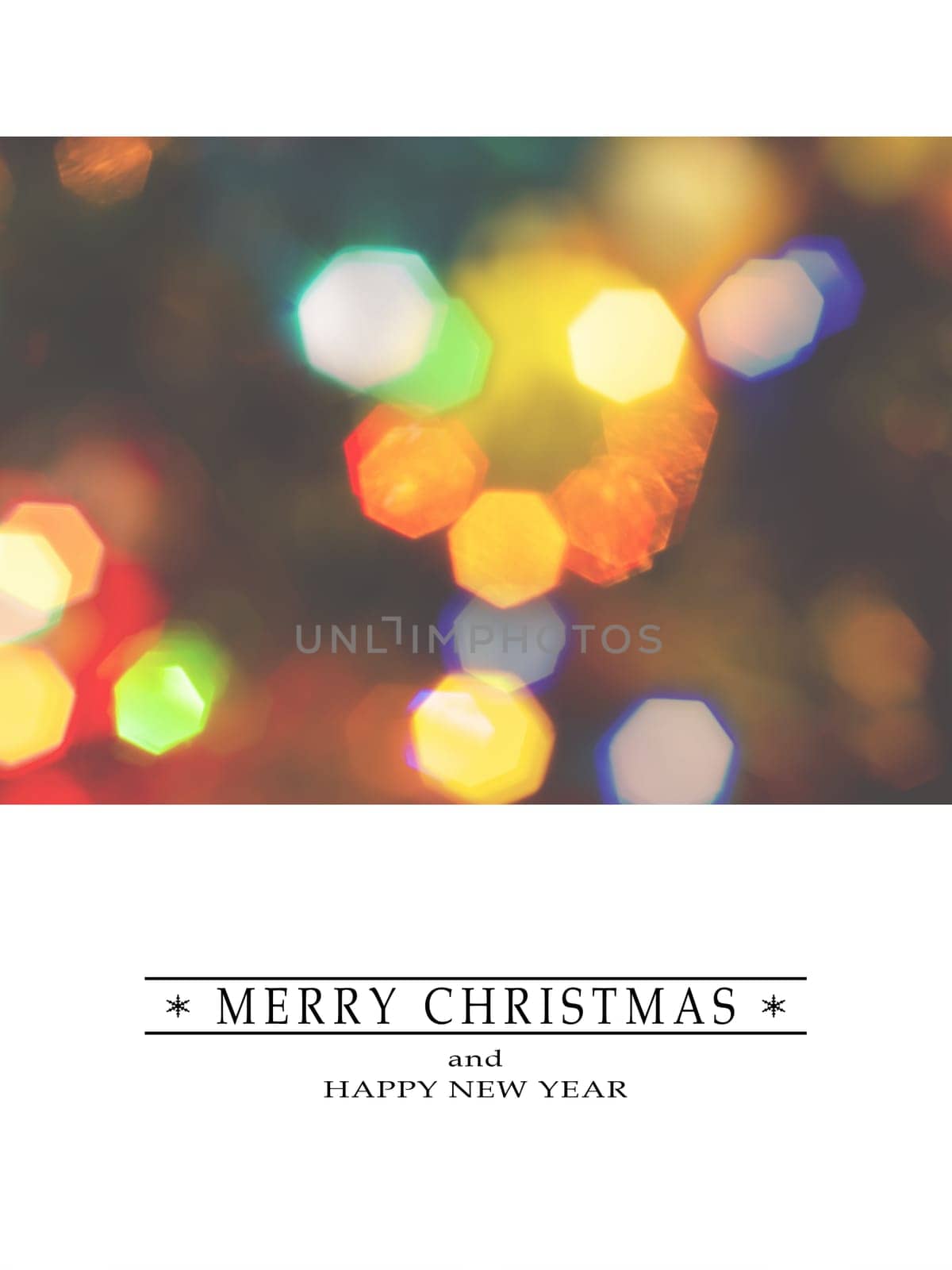 Merry Christmas and Happy New Year greeting card, blurred background of the twinkling lights of the Christmas tree. Greeting card background.