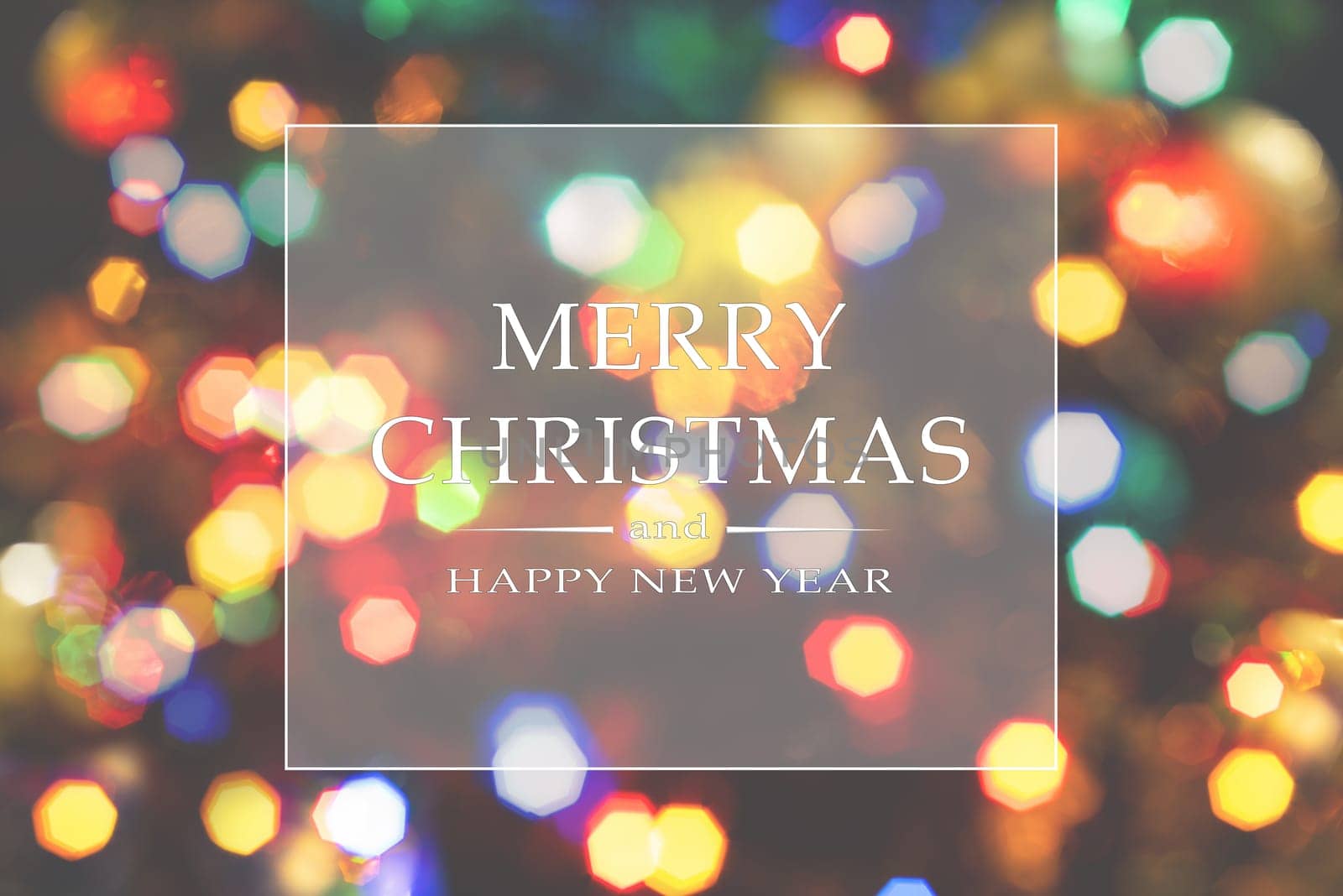 Merry Christmas and Happy New Year greeting card, blurred background of the twinkling lights of the Christmas tree. Greeting card background.