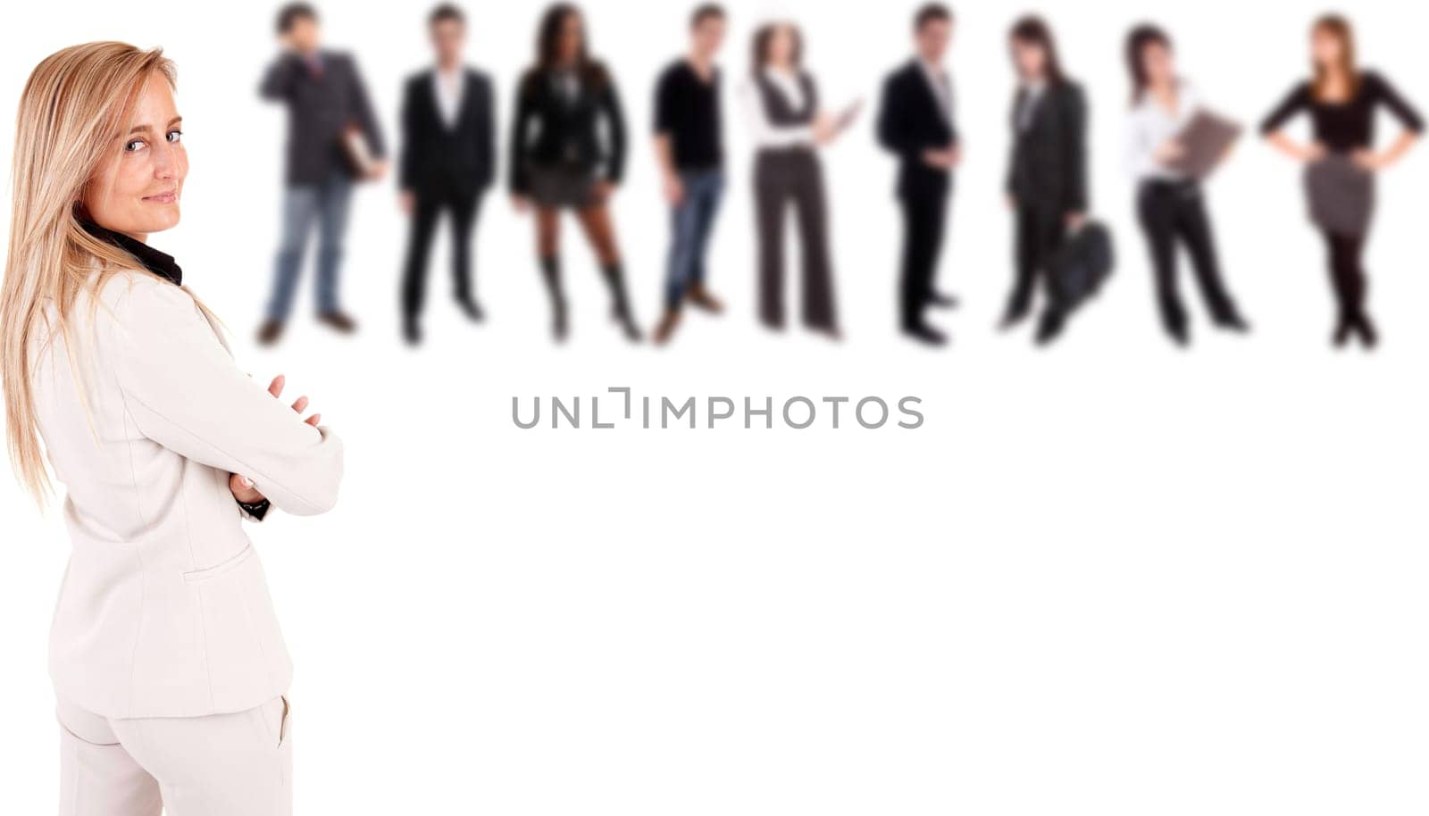 Beautiful business woman posing with group of people in the back