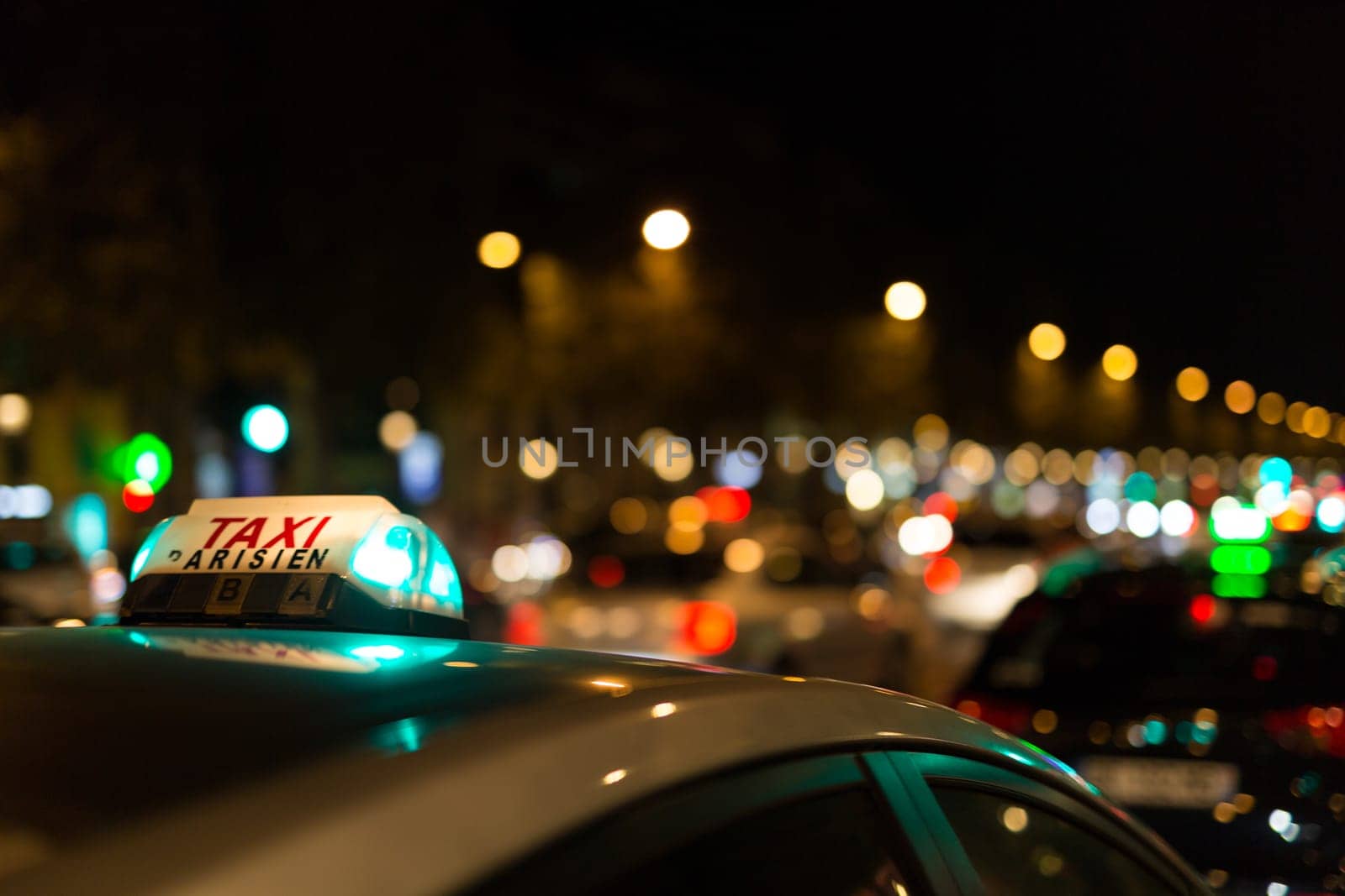French taxi with the champs elysees avenue in background