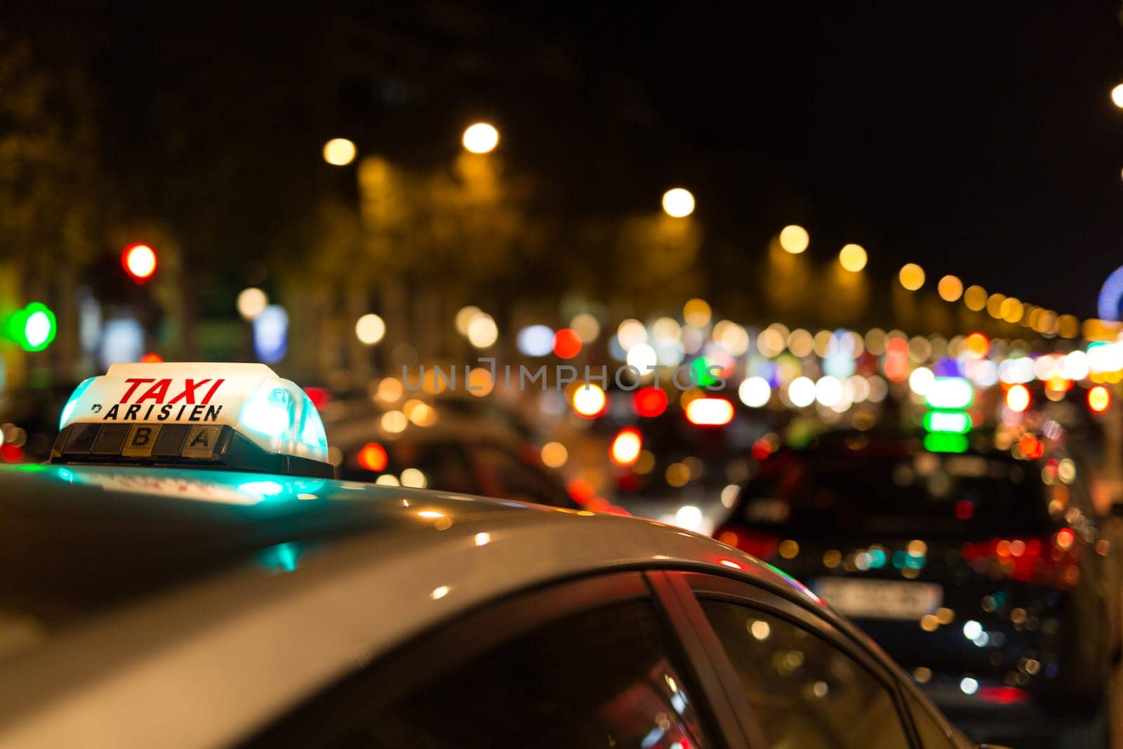 French taxi with the champs elysees avenue in background