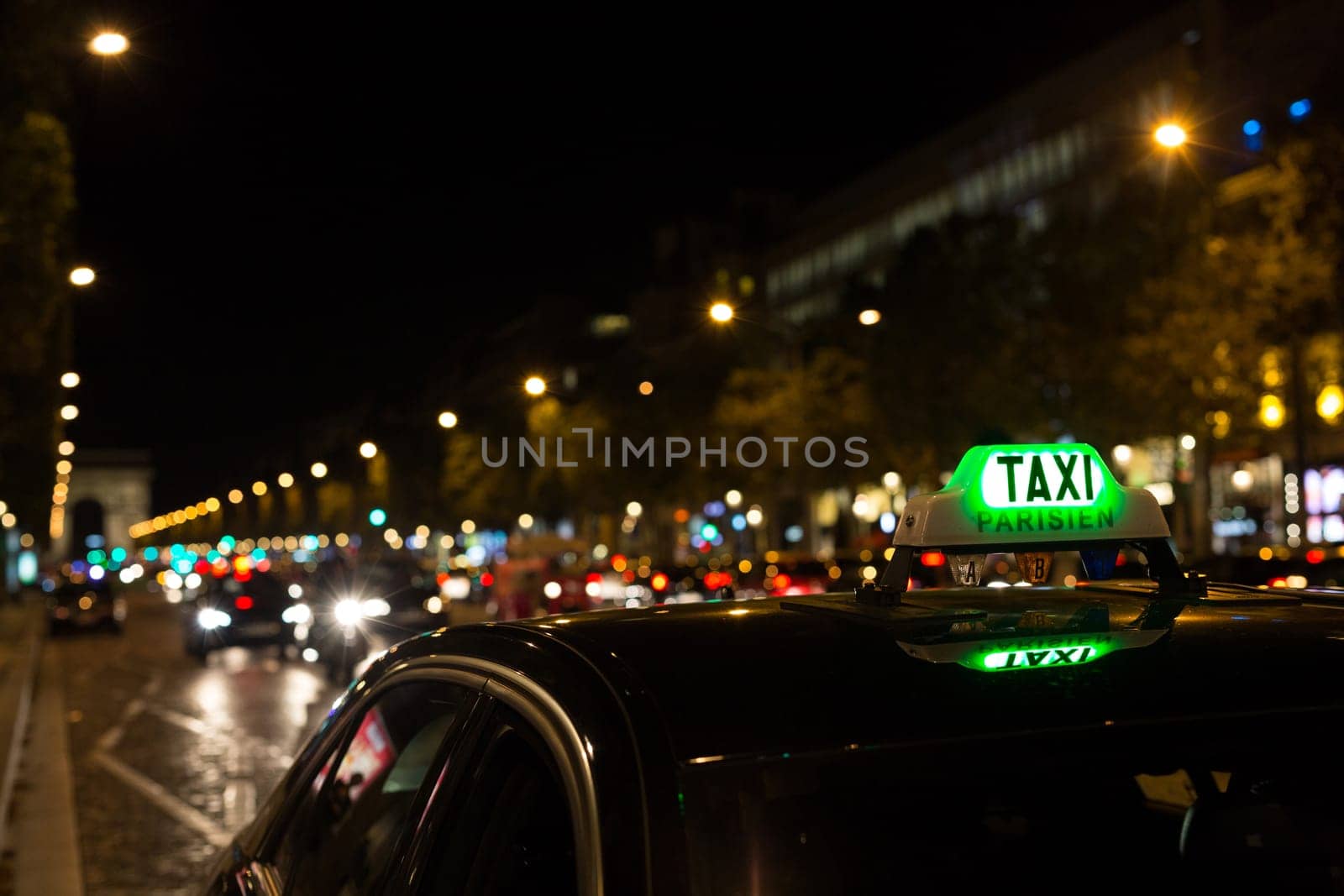 French taxi with the champs elysees avenue in background