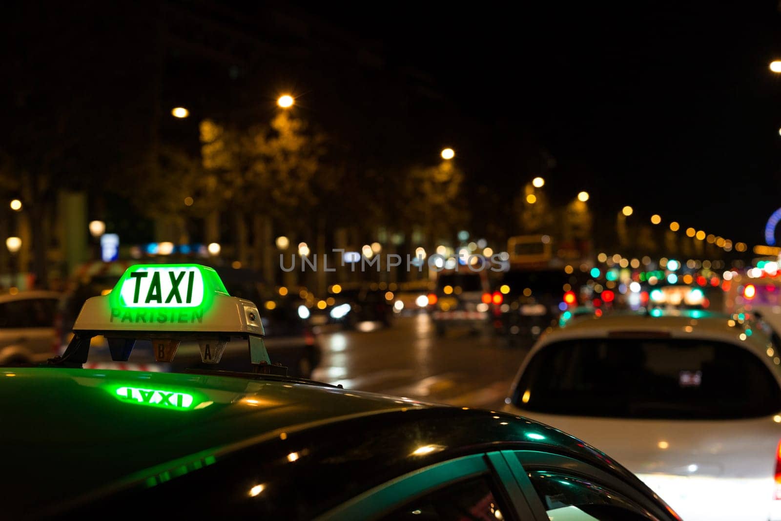 French taxi with the champs elysees avenue in background