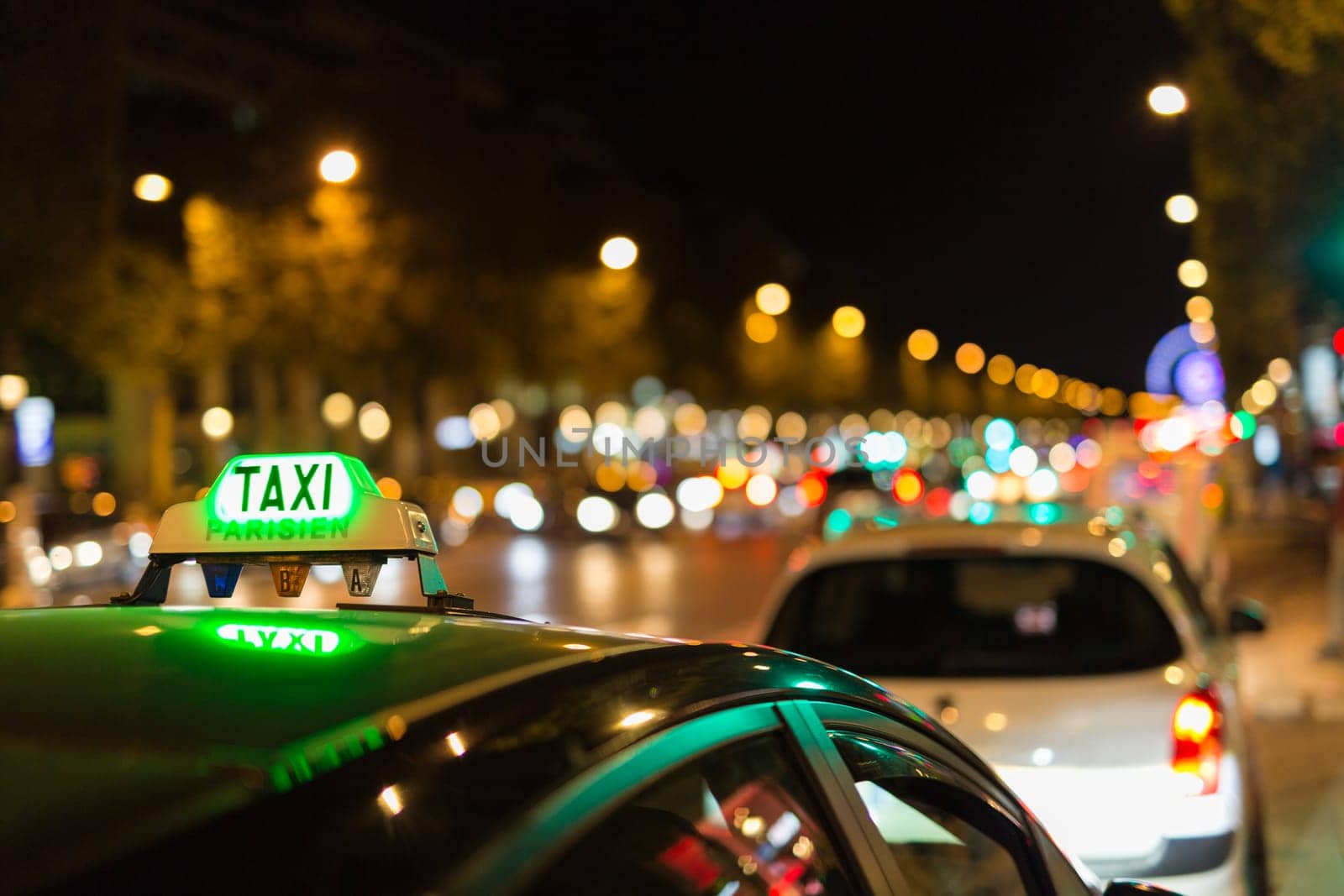 French taxi with the champs elysees avenue in background