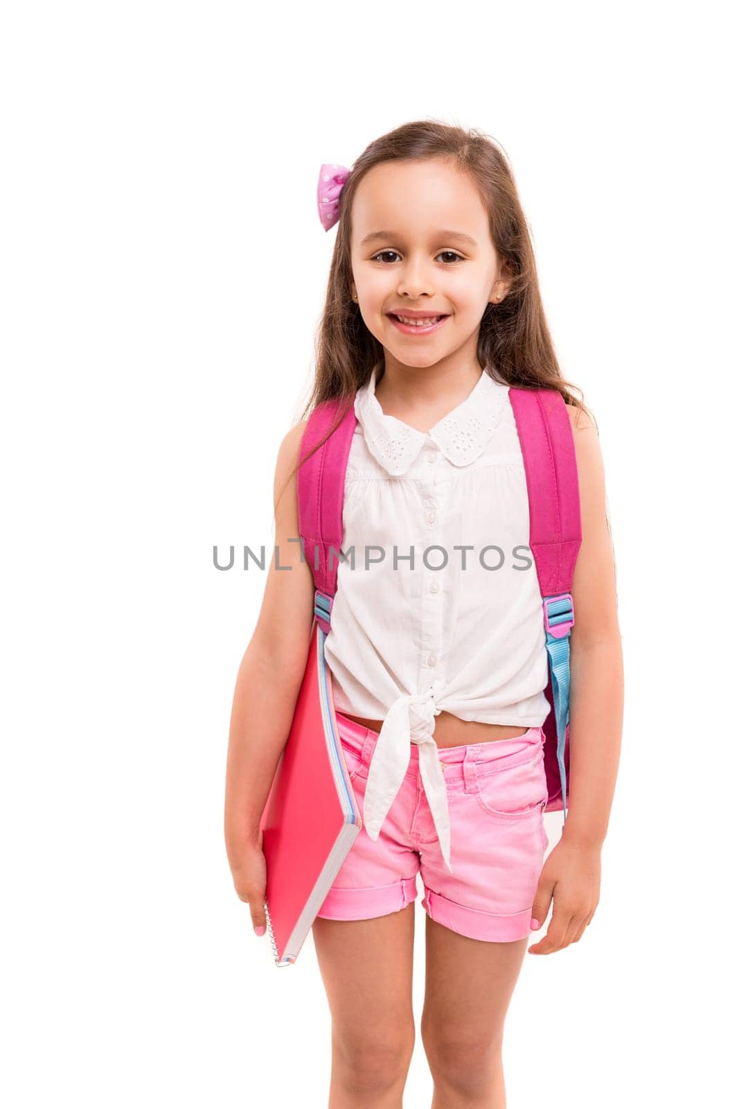 A small student posing isolated over white background